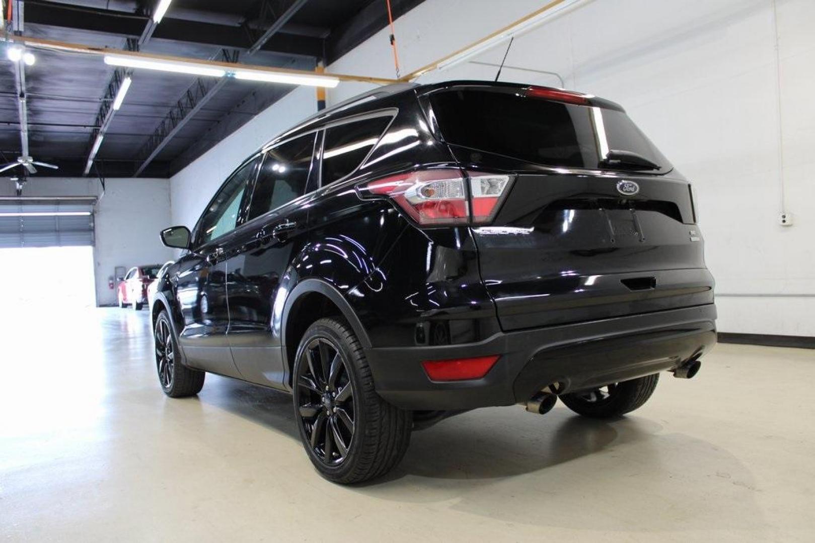 2018 Shadow Black /Charcoal Black Ford Escape SE (1FMCU0GD6JU) with an EcoBoost 2.0L I4 GTDi DOHC Turbocharged VCT engine, Automatic transmission, located at 15300 Midway Rd., Addison, TX, 75001, (972) 702-0011, 32.958321, -96.838074 - 2018 Ford Escape SE<br>Now Available at Midway Auto Group Addison, Texas<br><br>Well-rounded, efficient, and built for everyday versatility, the 2018 Ford Escape SE is the compact SUV that adapts to your lifestyle. With its turbocharged power, smooth ride, and smart interior layout, the Escape is i - Photo#3