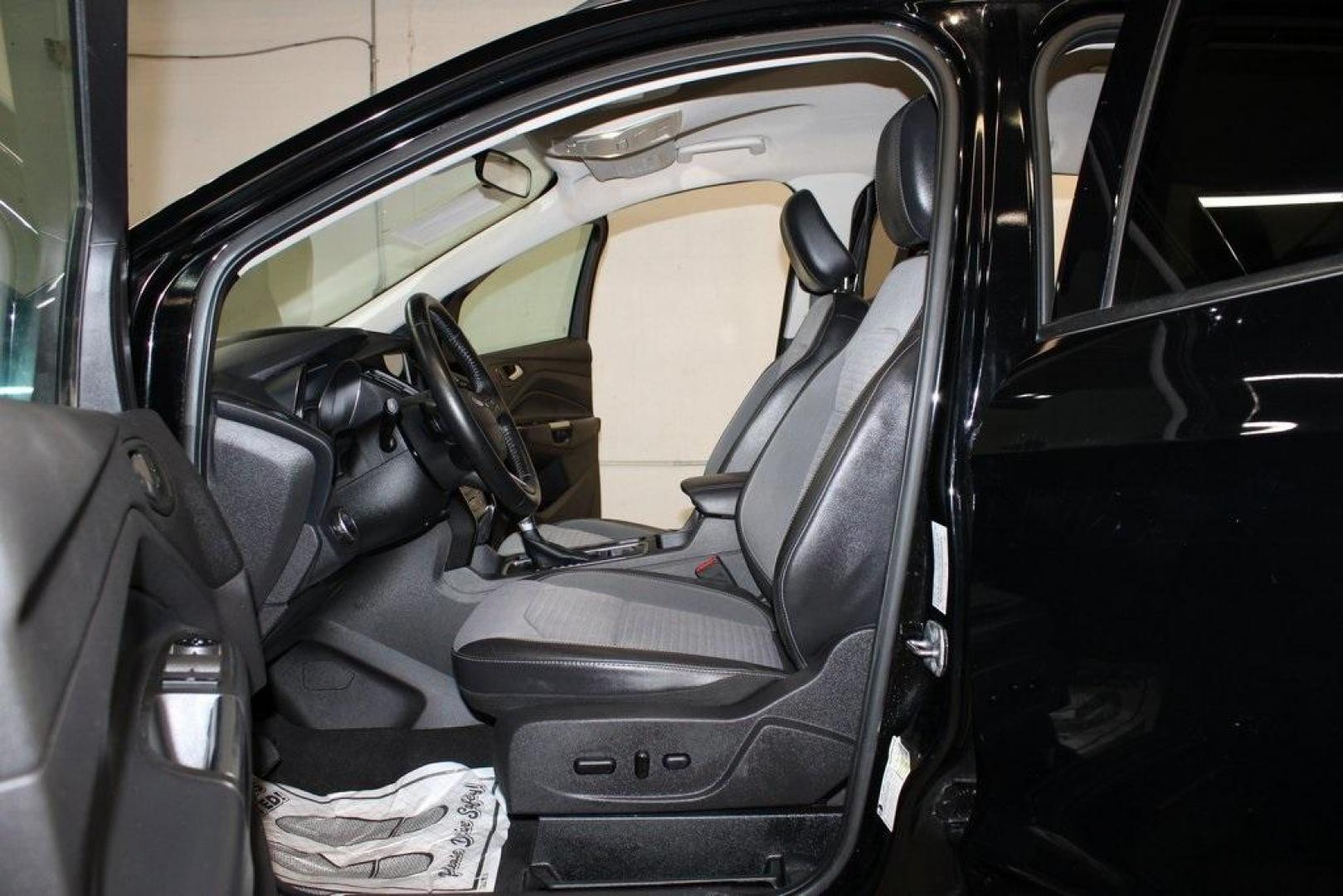 2018 Shadow Black /Charcoal Black Ford Escape SE (1FMCU0GD6JU) with an EcoBoost 2.0L I4 GTDi DOHC Turbocharged VCT engine, Automatic transmission, located at 15300 Midway Rd., Addison, TX, 75001, (972) 702-0011, 32.958321, -96.838074 - 2018 Ford Escape SE<br>Now Available at Midway Auto Group Addison, Texas<br><br>Well-rounded, efficient, and built for everyday versatility, the 2018 Ford Escape SE is the compact SUV that adapts to your lifestyle. With its turbocharged power, smooth ride, and smart interior layout, the Escape is i - Photo#14