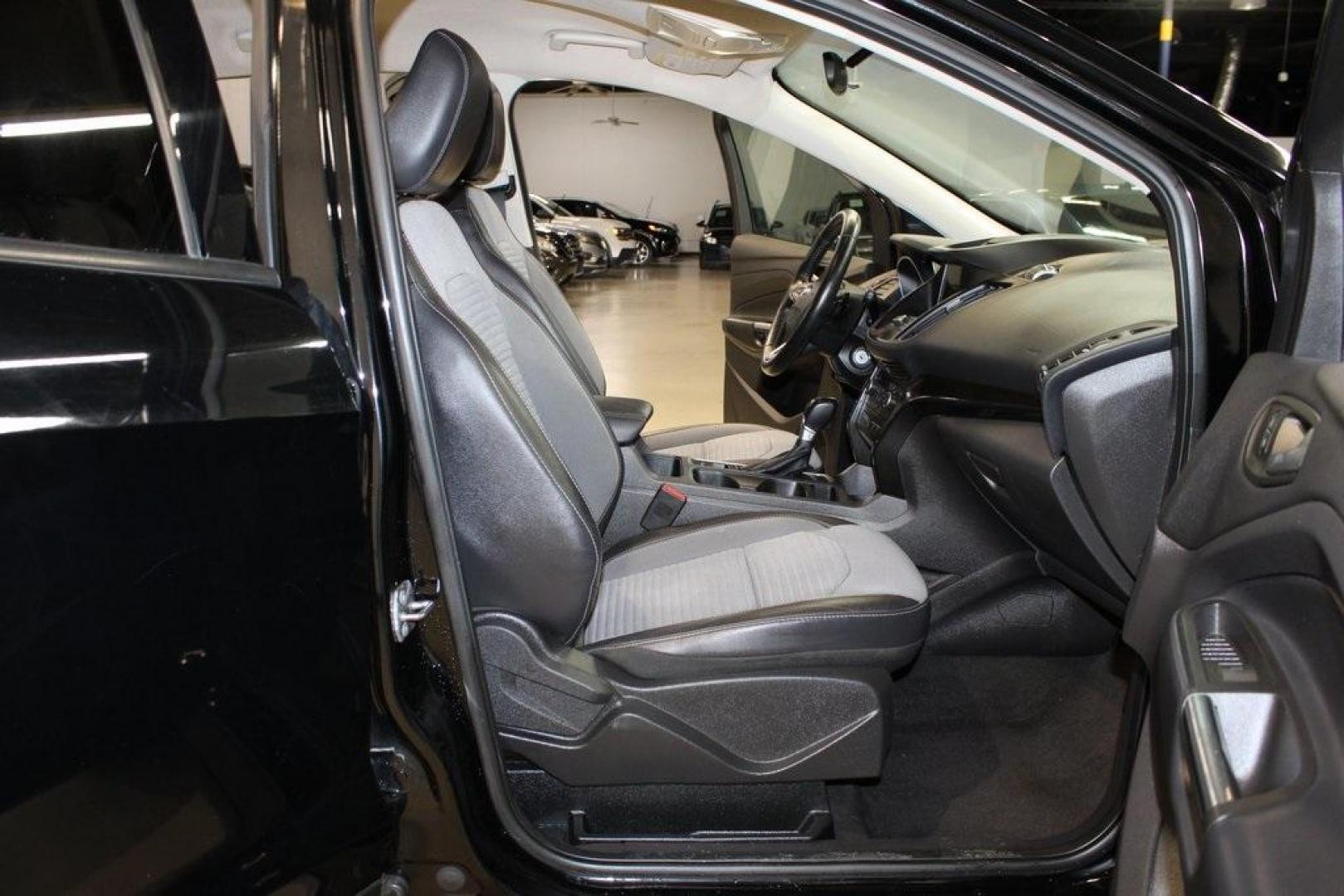 2018 Shadow Black /Charcoal Black Ford Escape SE (1FMCU0GD6JU) with an EcoBoost 2.0L I4 GTDi DOHC Turbocharged VCT engine, Automatic transmission, located at 15300 Midway Rd., Addison, TX, 75001, (972) 702-0011, 32.958321, -96.838074 - 2018 Ford Escape SE<br>Now Available at Midway Auto Group Addison, Texas<br><br>Well-rounded, efficient, and built for everyday versatility, the 2018 Ford Escape SE is the compact SUV that adapts to your lifestyle. With its turbocharged power, smooth ride, and smart interior layout, the Escape is i - Photo#15