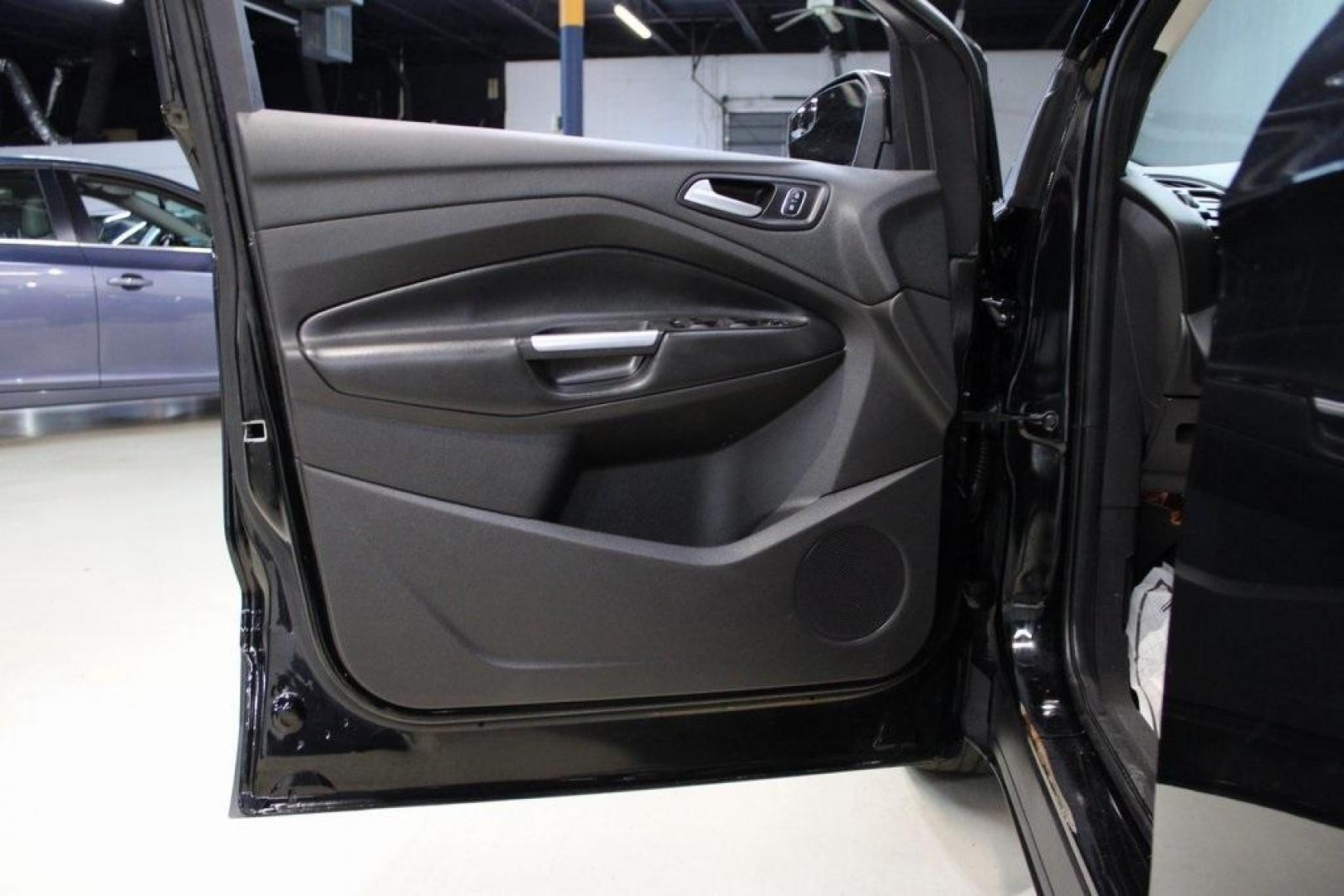 2018 Shadow Black /Charcoal Black Ford Escape SE (1FMCU0GD6JU) with an EcoBoost 2.0L I4 GTDi DOHC Turbocharged VCT engine, Automatic transmission, located at 15300 Midway Rd., Addison, TX, 75001, (972) 702-0011, 32.958321, -96.838074 - 2018 Ford Escape SE<br>Now Available at Midway Auto Group Addison, Texas<br><br>Well-rounded, efficient, and built for everyday versatility, the 2018 Ford Escape SE is the compact SUV that adapts to your lifestyle. With its turbocharged power, smooth ride, and smart interior layout, the Escape is i - Photo#25
