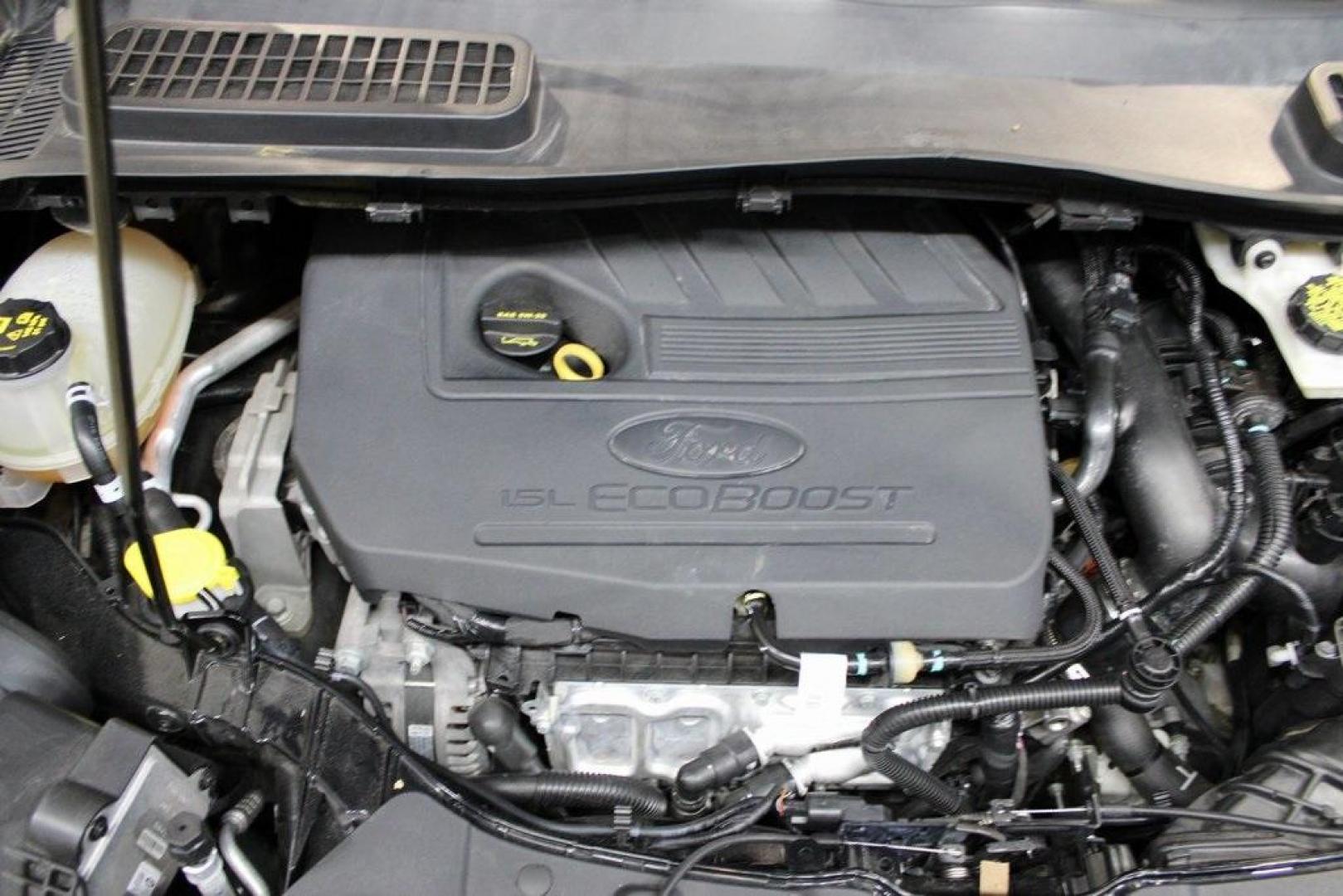 2018 Shadow Black /Charcoal Black Ford Escape SE (1FMCU0GD6JU) with an EcoBoost 2.0L I4 GTDi DOHC Turbocharged VCT engine, Automatic transmission, located at 15300 Midway Rd., Addison, TX, 75001, (972) 702-0011, 32.958321, -96.838074 - 2018 Ford Escape SE<br>Now Available at Midway Auto Group Addison, Texas<br><br>Well-rounded, efficient, and built for everyday versatility, the 2018 Ford Escape SE is the compact SUV that adapts to your lifestyle. With its turbocharged power, smooth ride, and smart interior layout, the Escape is i - Photo#27