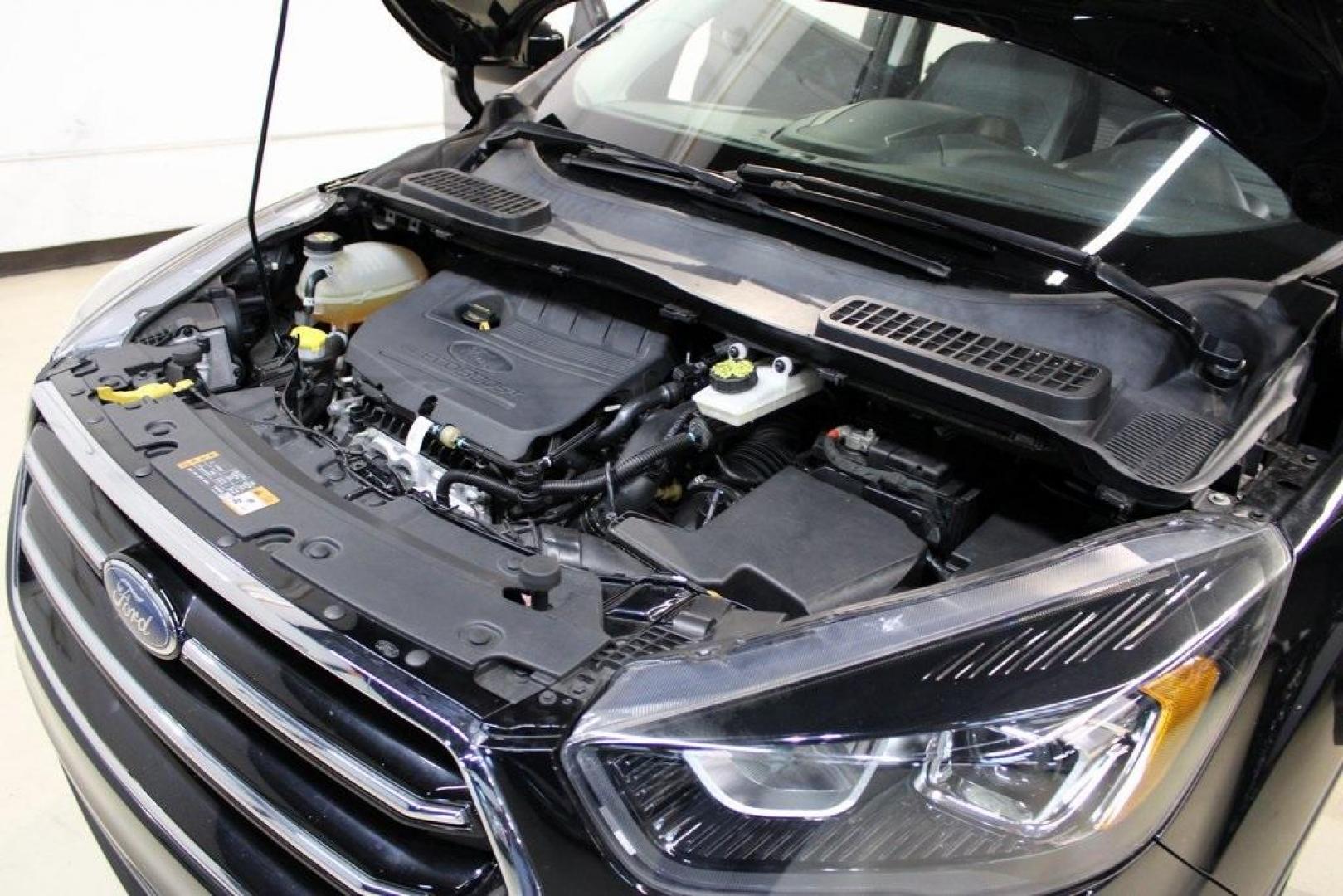 2018 Shadow Black /Charcoal Black Ford Escape SE (1FMCU0GD6JU) with an EcoBoost 2.0L I4 GTDi DOHC Turbocharged VCT engine, Automatic transmission, located at 15300 Midway Rd., Addison, TX, 75001, (972) 702-0011, 32.958321, -96.838074 - 2018 Ford Escape SE<br>Now Available at Midway Auto Group Addison, Texas<br><br>Well-rounded, efficient, and built for everyday versatility, the 2018 Ford Escape SE is the compact SUV that adapts to your lifestyle. With its turbocharged power, smooth ride, and smart interior layout, the Escape is i - Photo#28