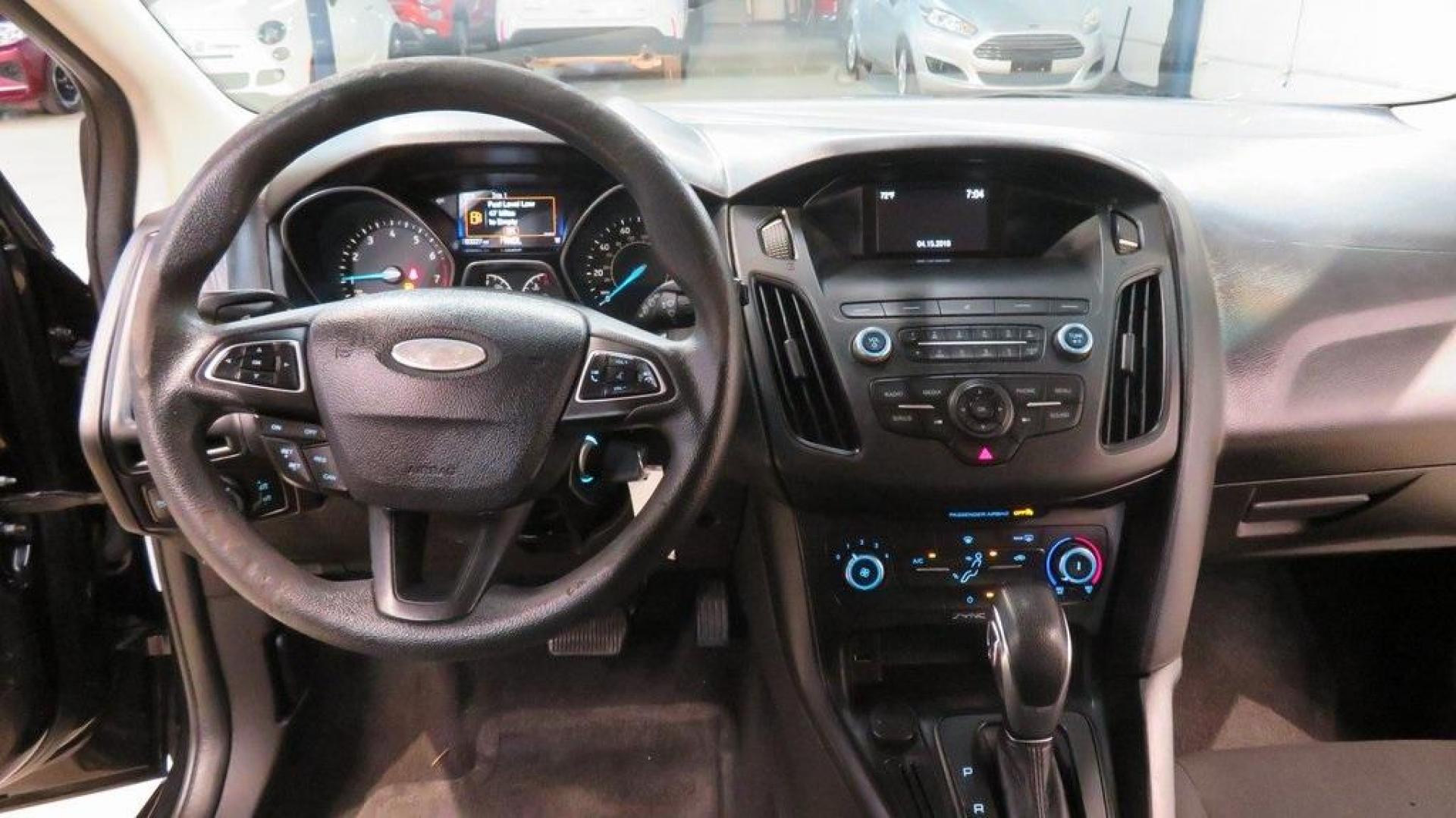 2018 Shadow Black /Charcoal Black Ford Focus SE (1FADP3K28JL) with an 2.0L I4 DGI Ti-VCT engine, Automatic transmission, located at 15300 Midway Rd., Addison, TX, 75001, (972) 702-0011, 32.958321, -96.838074 - 2018 Ford Focus SE Hatchback<br>Now Available at Midway Auto Group Addison, Texas<br><br>The 2018 Ford Focus SE Hatchback combines practicality, efficiency, and style, making it the ideal choice for daily commutes and weekend getaways alike. With its sporty handling, comfortable interior, and advan - Photo#17