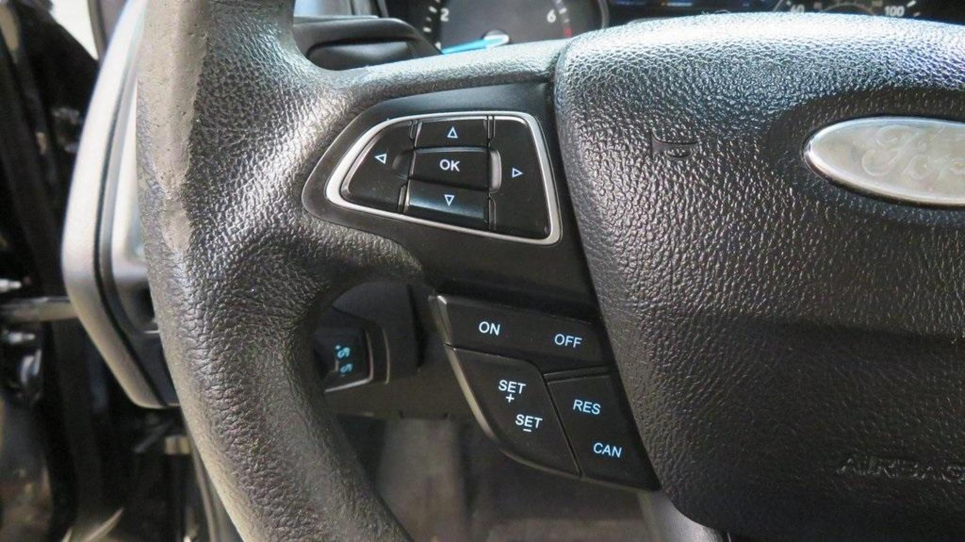 2018 Shadow Black /Charcoal Black Ford Focus SE (1FADP3K28JL) with an 2.0L I4 DGI Ti-VCT engine, Automatic transmission, located at 15300 Midway Rd., Addison, TX, 75001, (972) 702-0011, 32.958321, -96.838074 - 2018 Ford Focus SE Hatchback<br>Now Available at Midway Auto Group Addison, Texas<br><br>The 2018 Ford Focus SE Hatchback combines practicality, efficiency, and style, making it the ideal choice for daily commutes and weekend getaways alike. With its sporty handling, comfortable interior, and advan - Photo#24