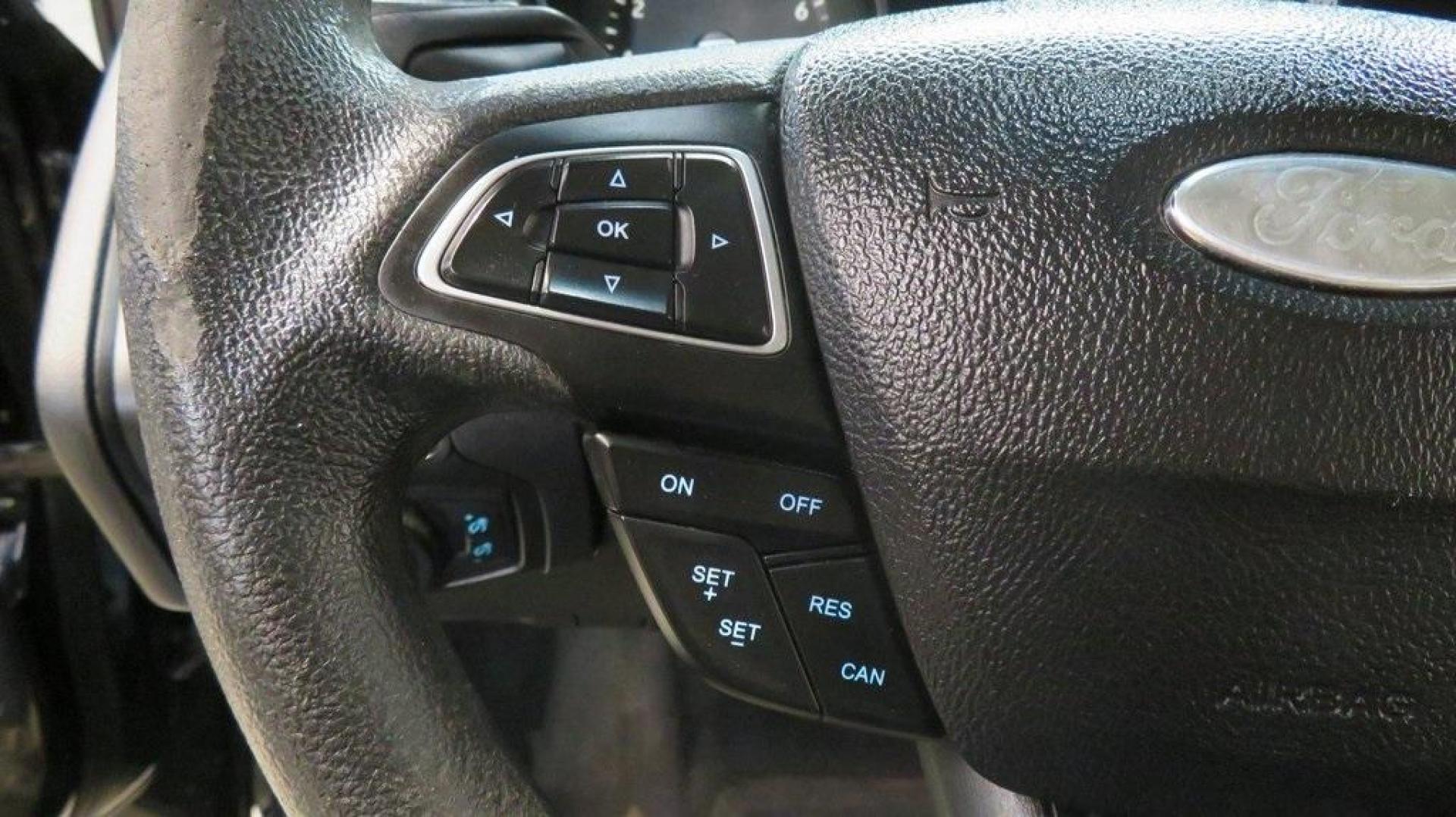 2018 Shadow Black /Charcoal Black Ford Focus SE (1FADP3K28JL) with an 2.0L I4 DGI Ti-VCT engine, Automatic transmission, located at 15300 Midway Rd., Addison, TX, 75001, (972) 702-0011, 32.958321, -96.838074 - 2018 Ford Focus SE Hatchback<br>Now Available at Midway Auto Group Addison, Texas<br><br>The 2018 Ford Focus SE Hatchback combines practicality, efficiency, and style, making it the ideal choice for daily commutes and weekend getaways alike. With its sporty handling, comfortable interior, and advan - Photo#25