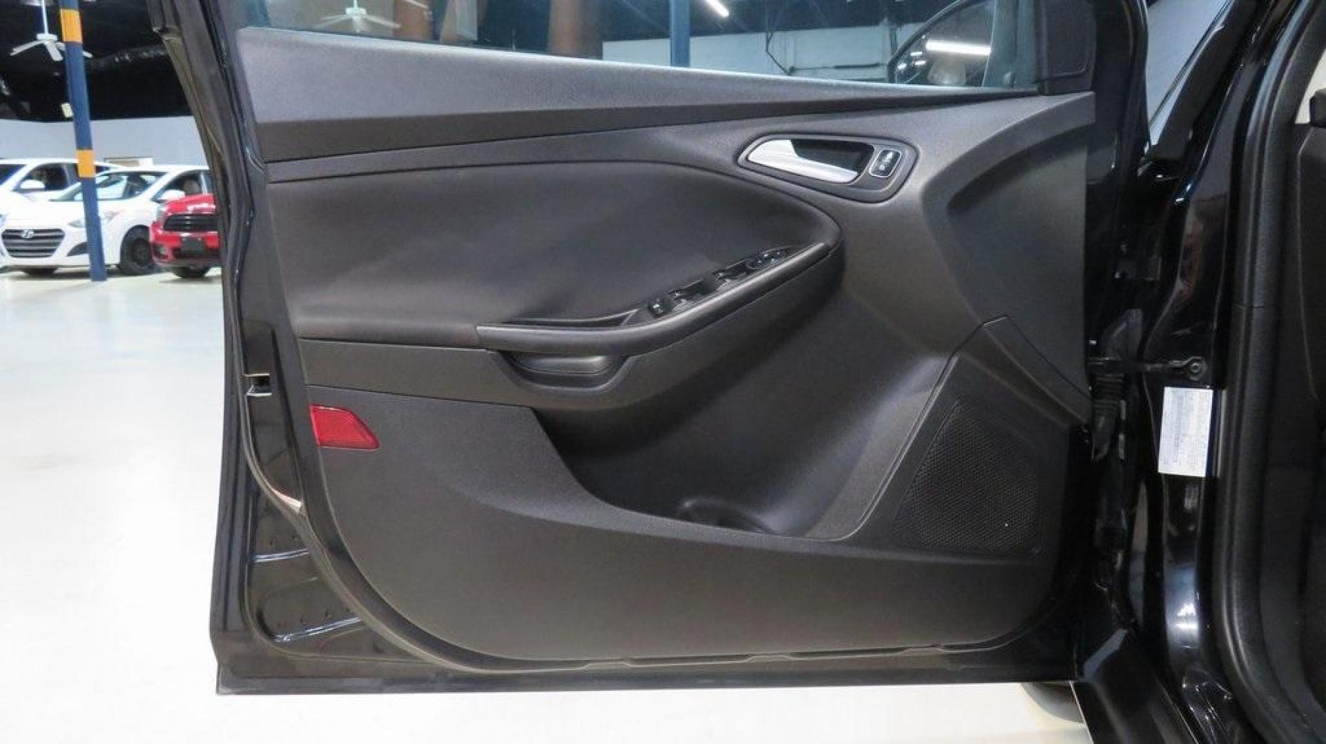 2018 Shadow Black /Charcoal Black Ford Focus SE (1FADP3K28JL) with an 2.0L I4 DGI Ti-VCT engine, Automatic transmission, located at 15300 Midway Rd., Addison, TX, 75001, (972) 702-0011, 32.958321, -96.838074 - 2018 Ford Focus SE Hatchback<br>Now Available at Midway Auto Group Addison, Texas<br><br>The 2018 Ford Focus SE Hatchback combines practicality, efficiency, and style, making it the ideal choice for daily commutes and weekend getaways alike. With its sporty handling, comfortable interior, and advan - Photo#26