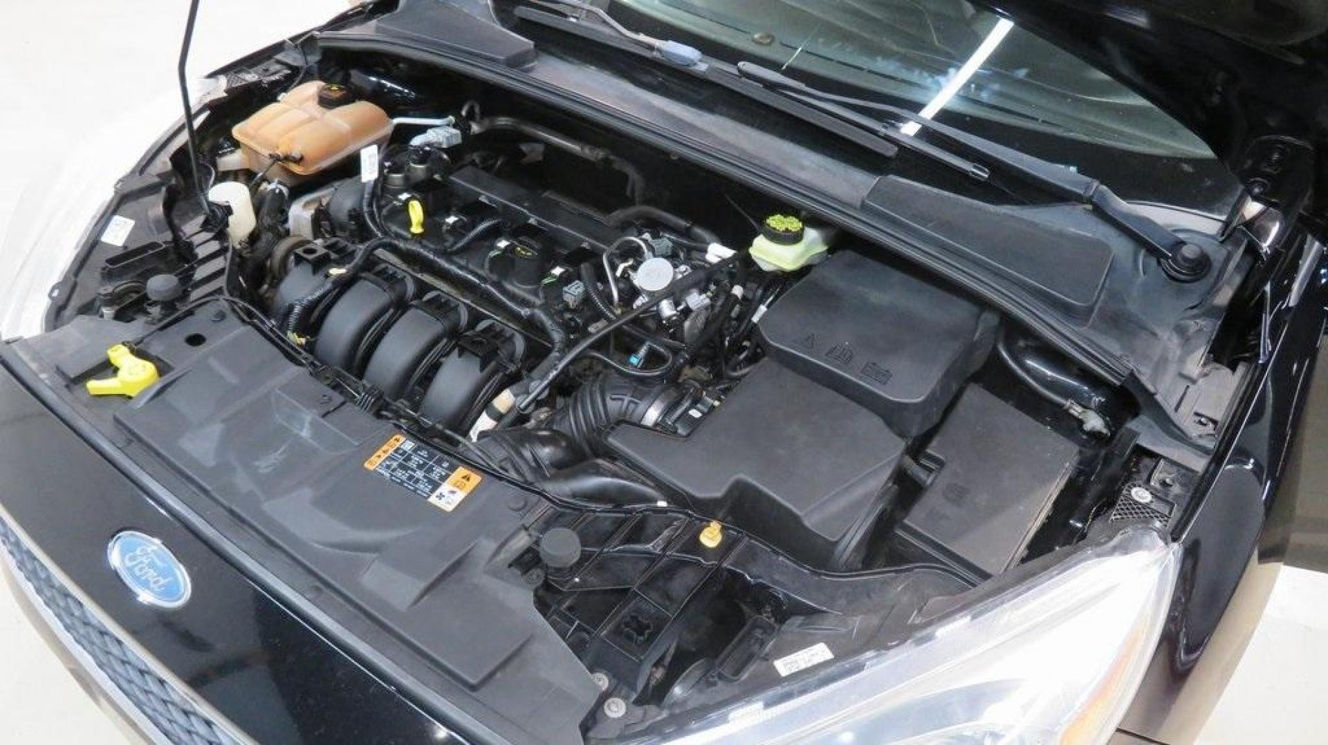 2018 Shadow Black /Charcoal Black Ford Focus SE (1FADP3K28JL) with an 2.0L I4 DGI Ti-VCT engine, Automatic transmission, located at 15300 Midway Rd., Addison, TX, 75001, (972) 702-0011, 32.958321, -96.838074 - 2018 Ford Focus SE Hatchback<br>Now Available at Midway Auto Group Addison, Texas<br><br>The 2018 Ford Focus SE Hatchback combines practicality, efficiency, and style, making it the ideal choice for daily commutes and weekend getaways alike. With its sporty handling, comfortable interior, and advan - Photo#29