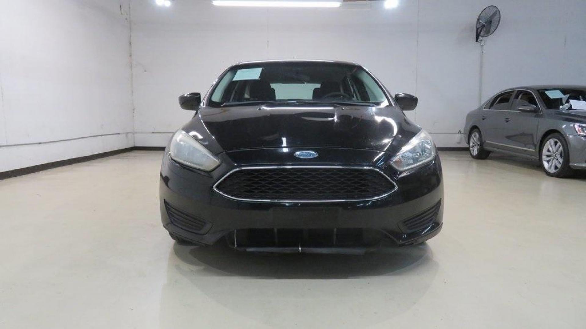 2018 Shadow Black /Charcoal Black Ford Focus SE (1FADP3K28JL) with an 2.0L I4 DGI Ti-VCT engine, Automatic transmission, located at 15300 Midway Rd., Addison, TX, 75001, (972) 702-0011, 32.958321, -96.838074 - 2018 Ford Focus SE Hatchback<br>Now Available at Midway Auto Group Addison, Texas<br><br>The 2018 Ford Focus SE Hatchback combines practicality, efficiency, and style, making it the ideal choice for daily commutes and weekend getaways alike. With its sporty handling, comfortable interior, and advan - Photo#5