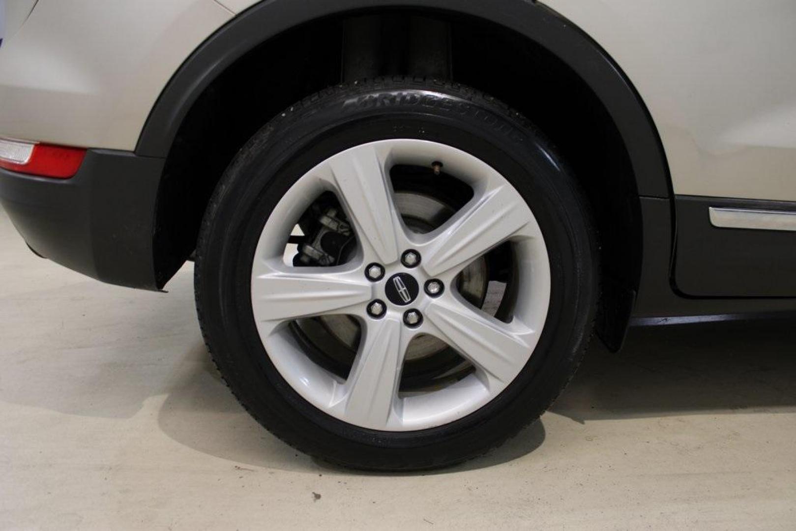 2015 Silver Sand /Ebony Lincoln MKC Base (5LMCJ1A95FU) with an EcoBoost 2.0L I4 GTDi DOHC Turbocharged VCT engine, Automatic transmission, located at 15300 Midway Rd., Addison, TX, 75001, (972) 702-0011, 32.958321, -96.838074 - 2015 Lincoln MKC<br>Available Now at Midway Auto Group Addison, Texas<br><br>Discover refined luxury and dynamic performance in this stunning 2015 Lincoln MKC. Designed for those who seek style, comfort, and a sophisticated driving experience, this premium crossover is perfectly suited for navigati - Photo#10