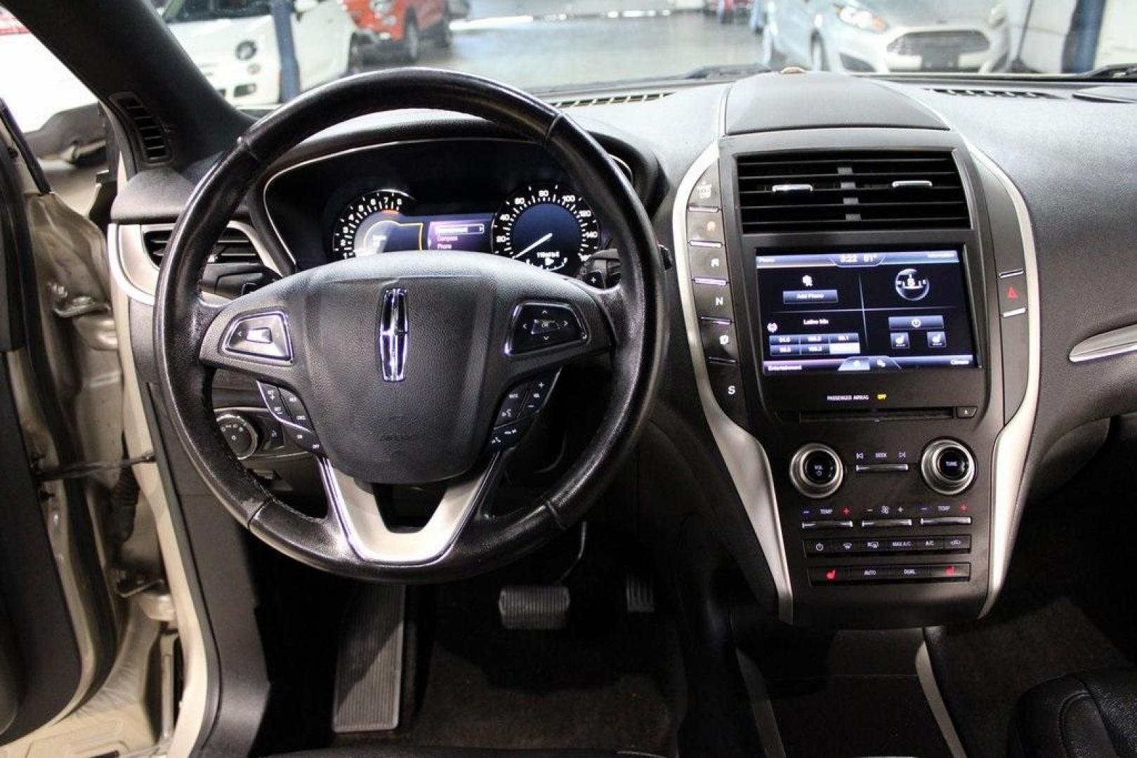 2015 Silver Sand /Ebony Lincoln MKC Base (5LMCJ1A95FU) with an EcoBoost 2.0L I4 GTDi DOHC Turbocharged VCT engine, Automatic transmission, located at 15300 Midway Rd., Addison, TX, 75001, (972) 702-0011, 32.958321, -96.838074 - 2015 Lincoln MKC<br>Available Now at Midway Auto Group Addison, Texas<br><br>Discover refined luxury and dynamic performance in this stunning 2015 Lincoln MKC. Designed for those who seek style, comfort, and a sophisticated driving experience, this premium crossover is perfectly suited for navigati - Photo#17