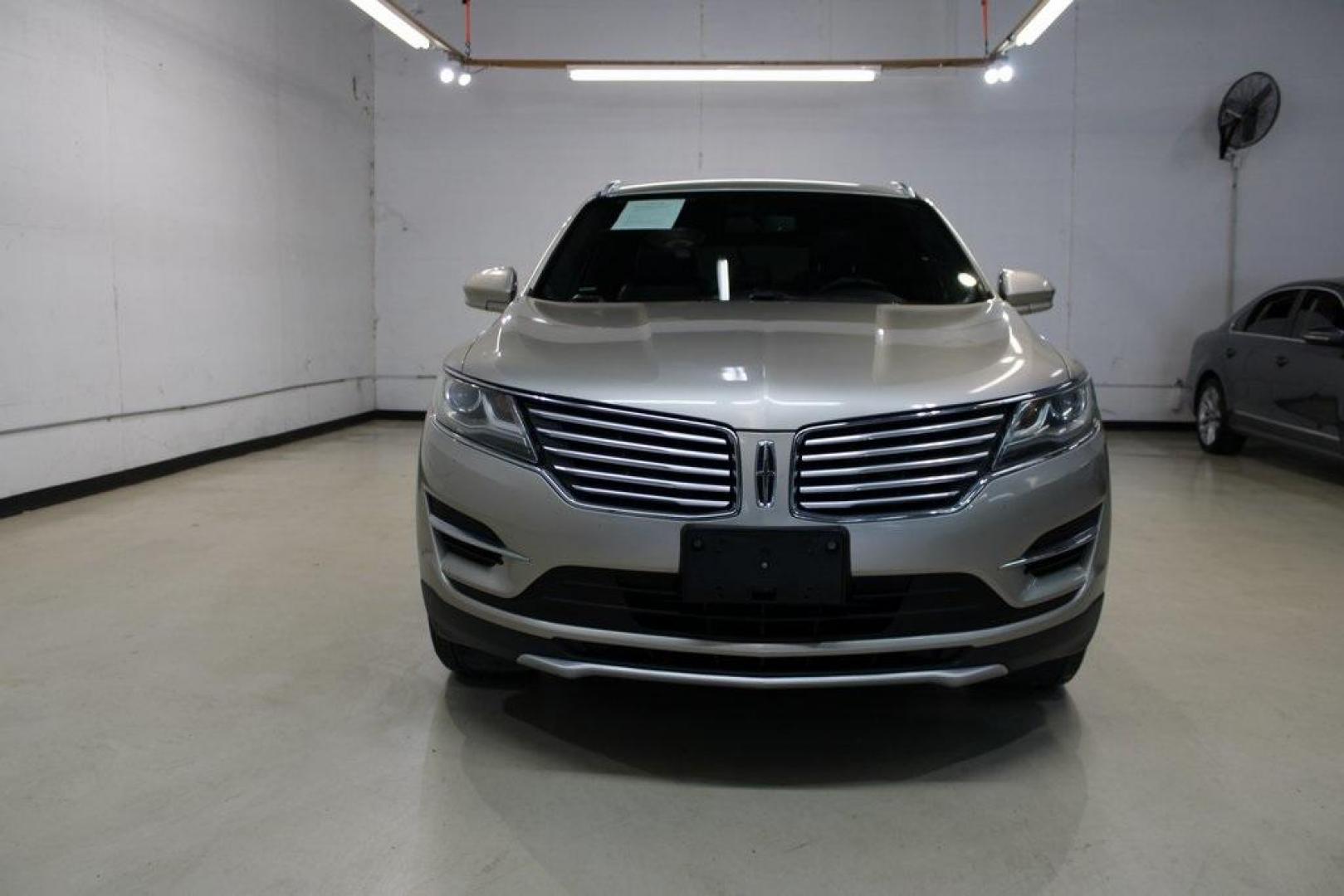 2015 Silver Sand /Ebony Lincoln MKC Base (5LMCJ1A95FU) with an EcoBoost 2.0L I4 GTDi DOHC Turbocharged VCT engine, Automatic transmission, located at 15300 Midway Rd., Addison, TX, 75001, (972) 702-0011, 32.958321, -96.838074 - 2015 Lincoln MKC<br>Available Now at Midway Auto Group Addison, Texas<br><br>Discover refined luxury and dynamic performance in this stunning 2015 Lincoln MKC. Designed for those who seek style, comfort, and a sophisticated driving experience, this premium crossover is perfectly suited for navigati - Photo#5