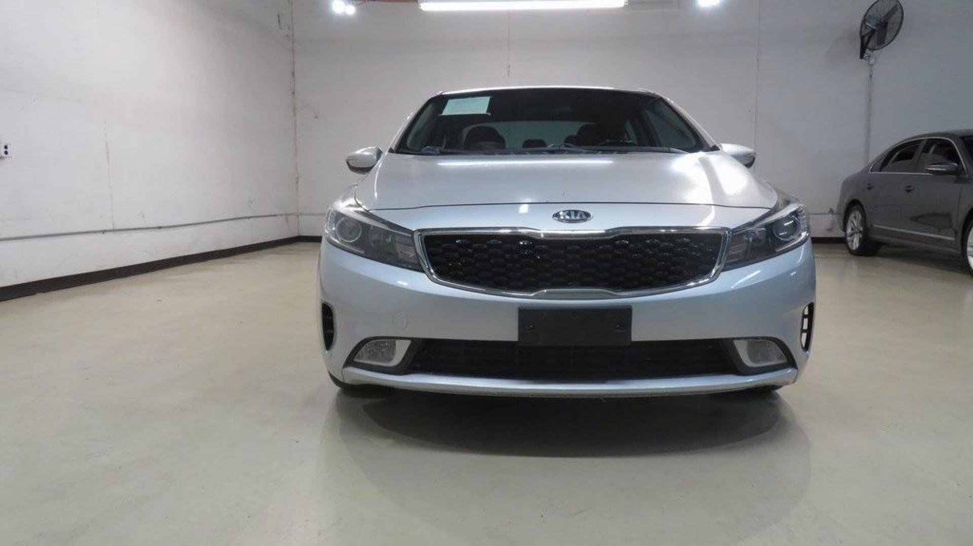 2017 Silky Silver /Black Kia Forte EX (3KPFL4A8XHE) with an 2.0L I4 DOHC Dual CVVT engine, Automatic transmission, located at 15300 Midway Rd., Addison, TX, 75001, (972) 702-0011, 32.958321, -96.838074 - 2017 Kia Forte LX<br>Available Now at Midway Auto Group Addison, Texas<br><br>Reliable, efficient, and stylish, the 2017 Kia Forte LX makes an excellent choice for drivers seeking a comfortable and affordable daily driver. Perfect for navigating Addison streets or commuting across the Dallas-Fort W - Photo#1