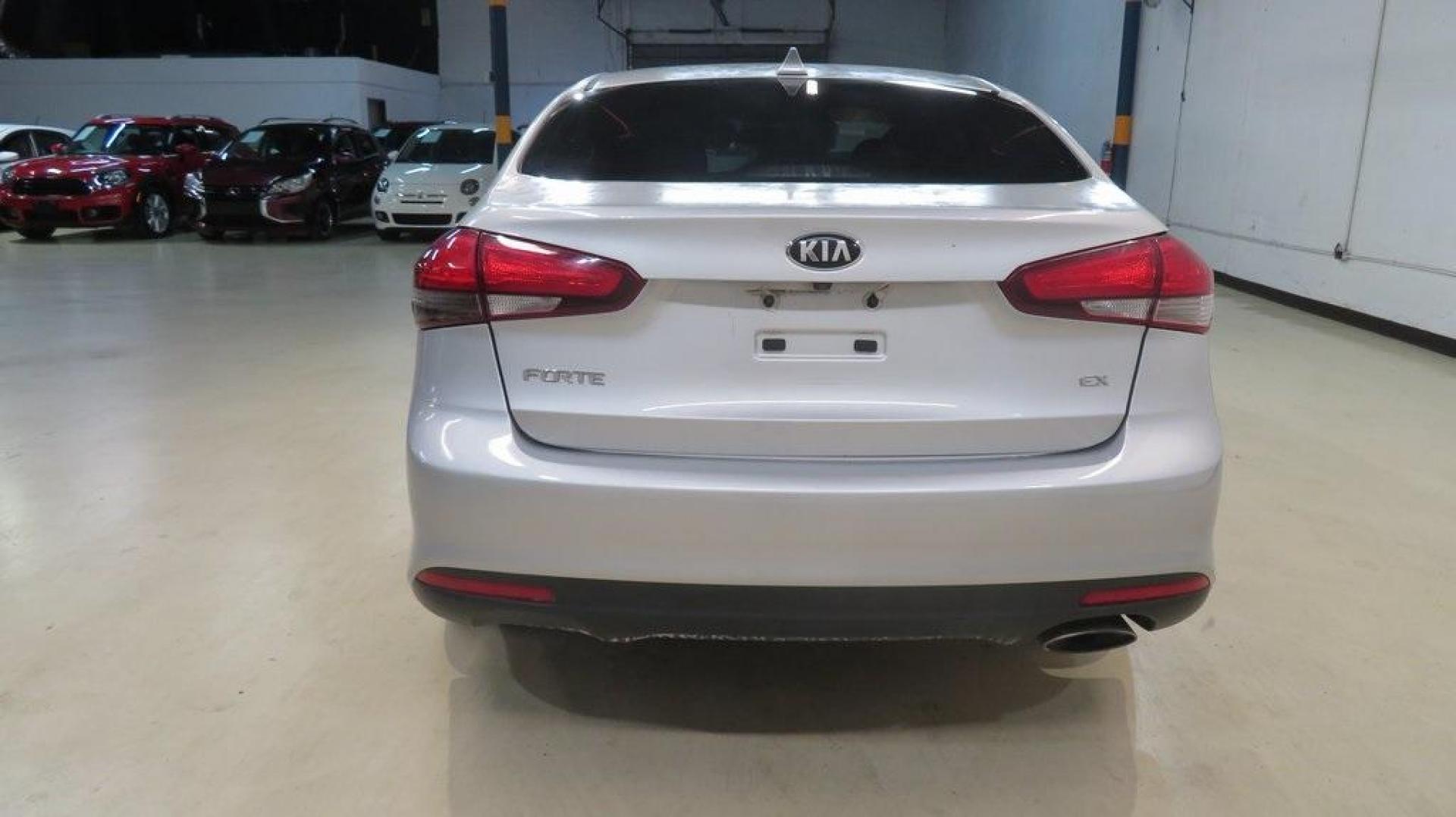 2017 Silky Silver /Black Kia Forte EX (3KPFL4A8XHE) with an 2.0L I4 DOHC Dual CVVT engine, Automatic transmission, located at 15300 Midway Rd., Addison, TX, 75001, (972) 702-0011, 32.958321, -96.838074 - 2017 Kia Forte LX<br>Available Now at Midway Auto Group Addison, Texas<br><br>Reliable, efficient, and stylish, the 2017 Kia Forte LX makes an excellent choice for drivers seeking a comfortable and affordable daily driver. Perfect for navigating Addison streets or commuting across the Dallas-Fort W - Photo#2