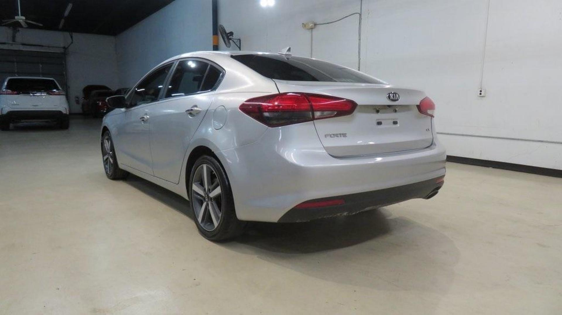2017 Silky Silver /Black Kia Forte EX (3KPFL4A8XHE) with an 2.0L I4 DOHC Dual CVVT engine, Automatic transmission, located at 15300 Midway Rd., Addison, TX, 75001, (972) 702-0011, 32.958321, -96.838074 - 2017 Kia Forte LX<br>Available Now at Midway Auto Group Addison, Texas<br><br>Reliable, efficient, and stylish, the 2017 Kia Forte LX makes an excellent choice for drivers seeking a comfortable and affordable daily driver. Perfect for navigating Addison streets or commuting across the Dallas-Fort W - Photo#3