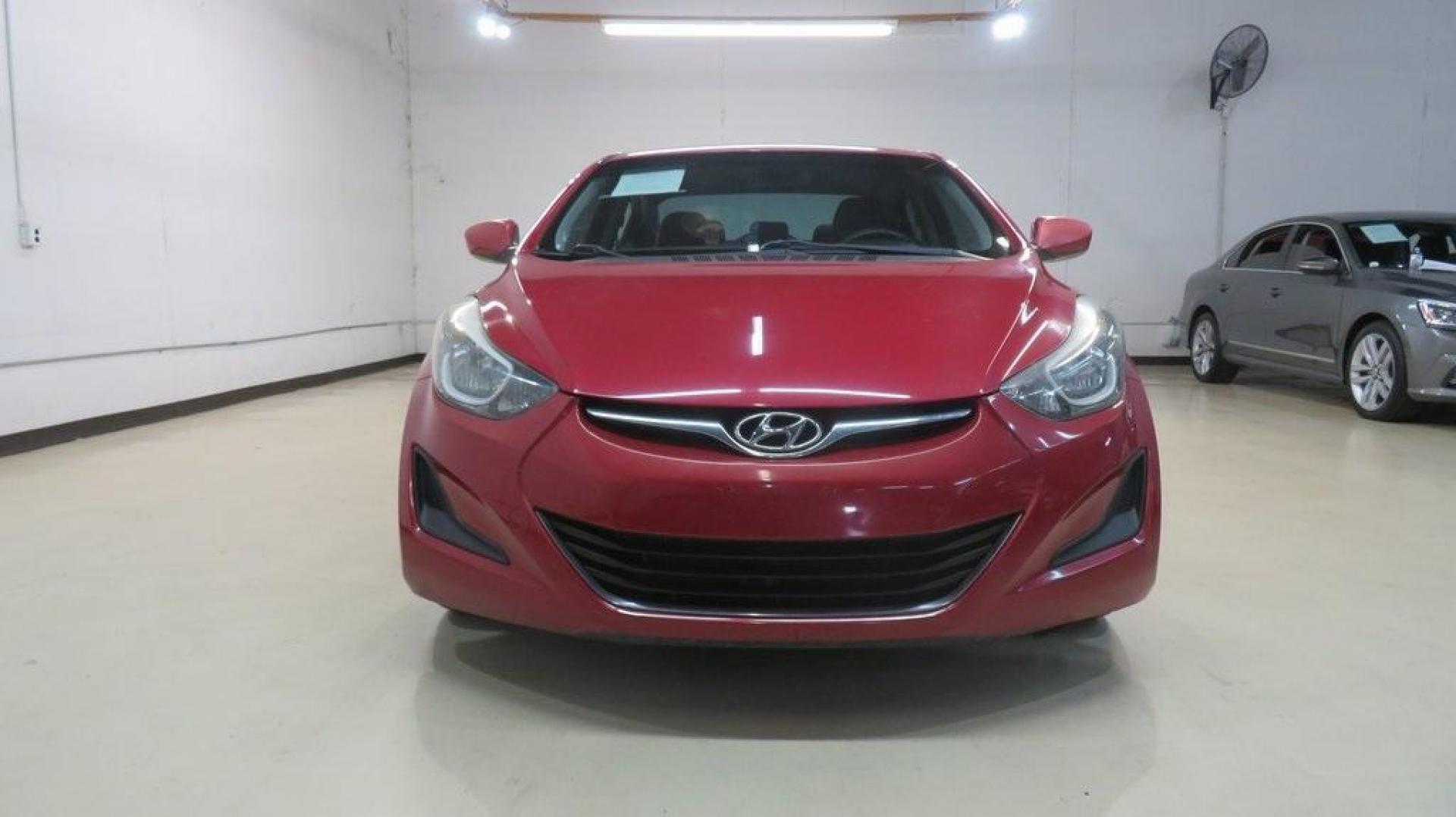 2016 Geranium Red /Gray Hyundai Elantra SE (KMHDH4AE9GU) with an 1.8L 4-Cylinder DOHC 16V Dual CVVT engine, Automatic transmission, located at 15300 Midway Rd., Addison, TX, 75001, (972) 702-0011, 32.958321, -96.838074 - 2016 Hyundai Elantra SE<br>Now Available at Midway Auto Group Addison, Texas<br><br>Smart, efficient, and comfortable, the 2016 Hyundai Elantra SE delivers an outstanding blend of value, reliability, and style. Whether commuting through Addison or heading out on a weekend road trip across Texas, th - Photo#5