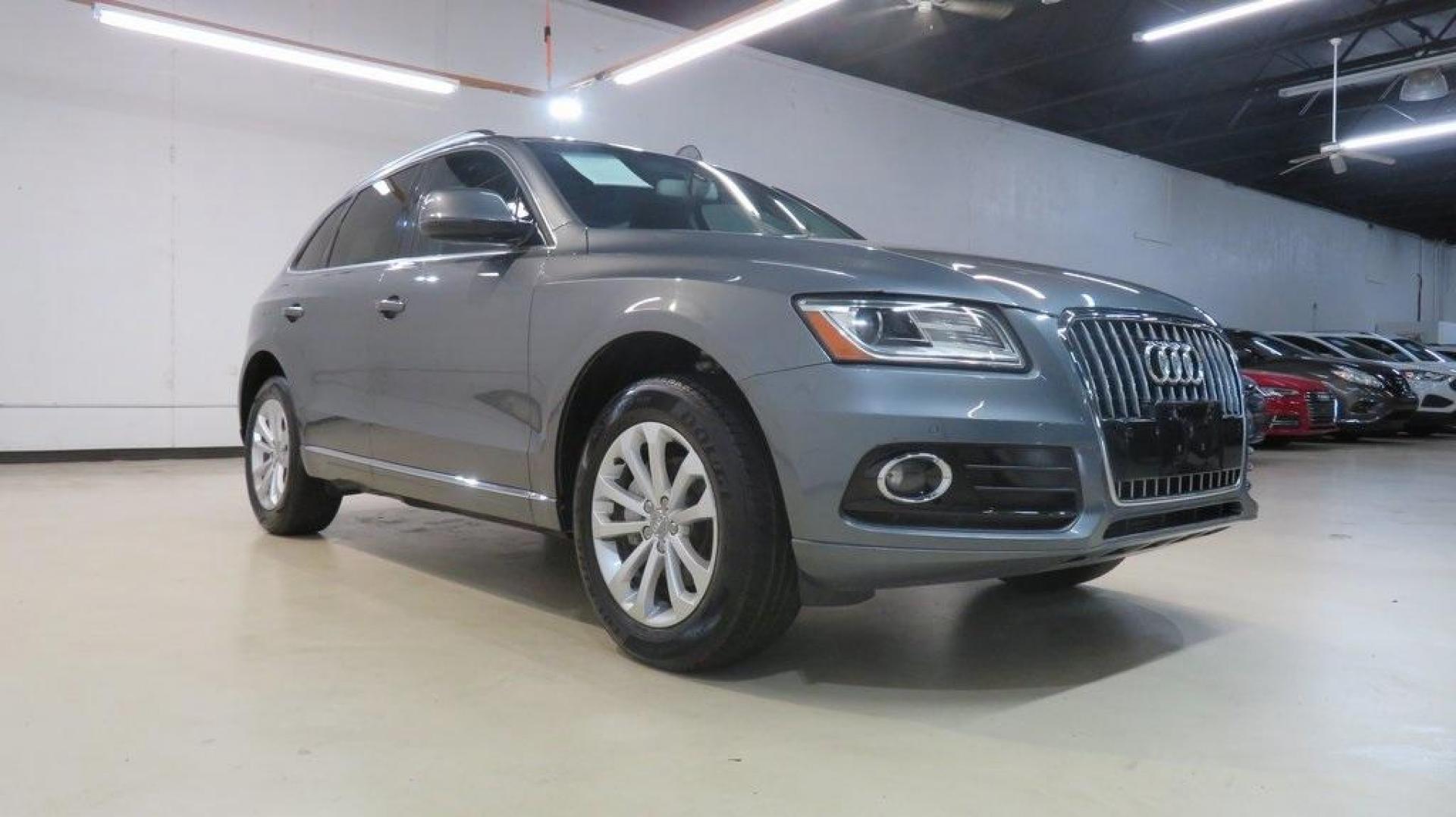 2016 Turquoise /Black/Cognac Audi Q5 2.0T Premium Plus (WA1L2AFP0GA) with an 2.0L 4-Cylinder TFSI engine, Automatic transmission, located at 15300 Midway Rd., Addison, TX, 75001, (972) 702-0011, 32.958321, -96.838074 - 2016 Audi Q5 Premium Plus<br>Available Now at Midway Auto Group Addison, Texas<br><br>Step into refined luxury and dynamic performance with the 2016 Audi Q5 Premium Plus. Offering the perfect blend of sophistication, utility, and Quattro all-wheel-drive capability, this premium SUV is designed for - Photo#1