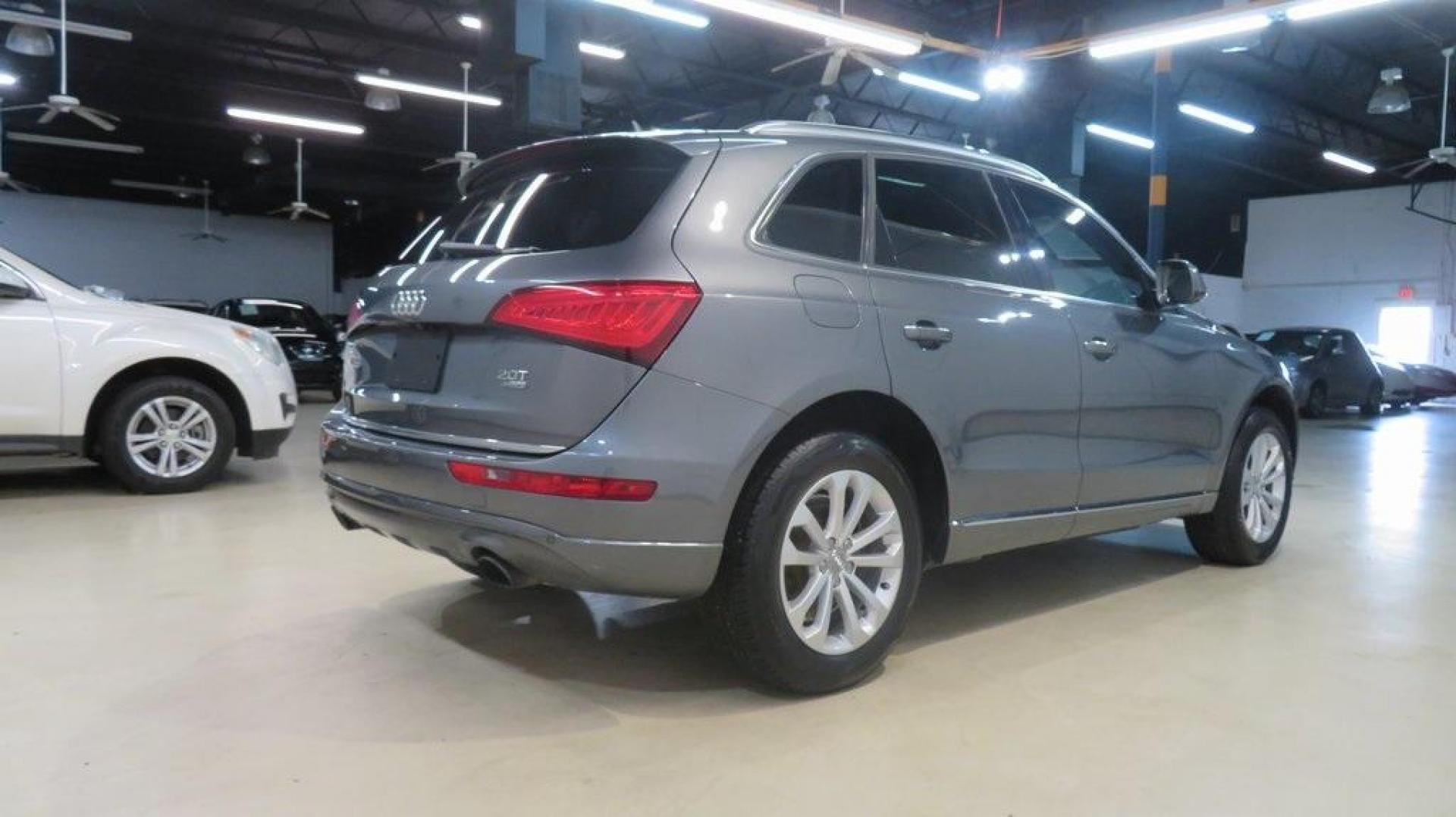 2016 Turquoise /Black/Cognac Audi Q5 2.0T Premium Plus (WA1L2AFP0GA) with an 2.0L 4-Cylinder TFSI engine, Automatic transmission, located at 15300 Midway Rd., Addison, TX, 75001, (972) 702-0011, 32.958321, -96.838074 - 2016 Audi Q5 Premium Plus<br>Available Now at Midway Auto Group Addison, Texas<br><br>Step into refined luxury and dynamic performance with the 2016 Audi Q5 Premium Plus. Offering the perfect blend of sophistication, utility, and Quattro all-wheel-drive capability, this premium SUV is designed for - Photo#2