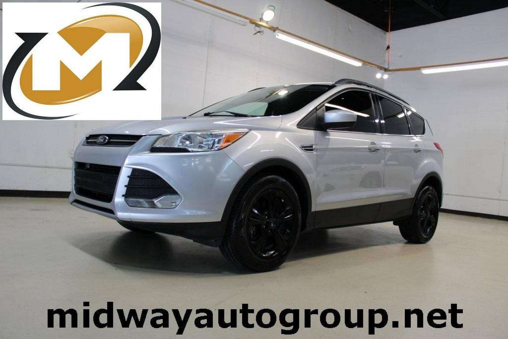 2014 Ingot Silver /Black Ford Escape SE (1FMCU0GX0EU) with an EcoBoost 1.6L I4 GTDi DOHC Turbocharged VCT engine, Automatic transmission, located at 15300 Midway Rd., Addison, TX, 75001, (972) 702-0011, 32.958321, -96.838074 - Photo#0
