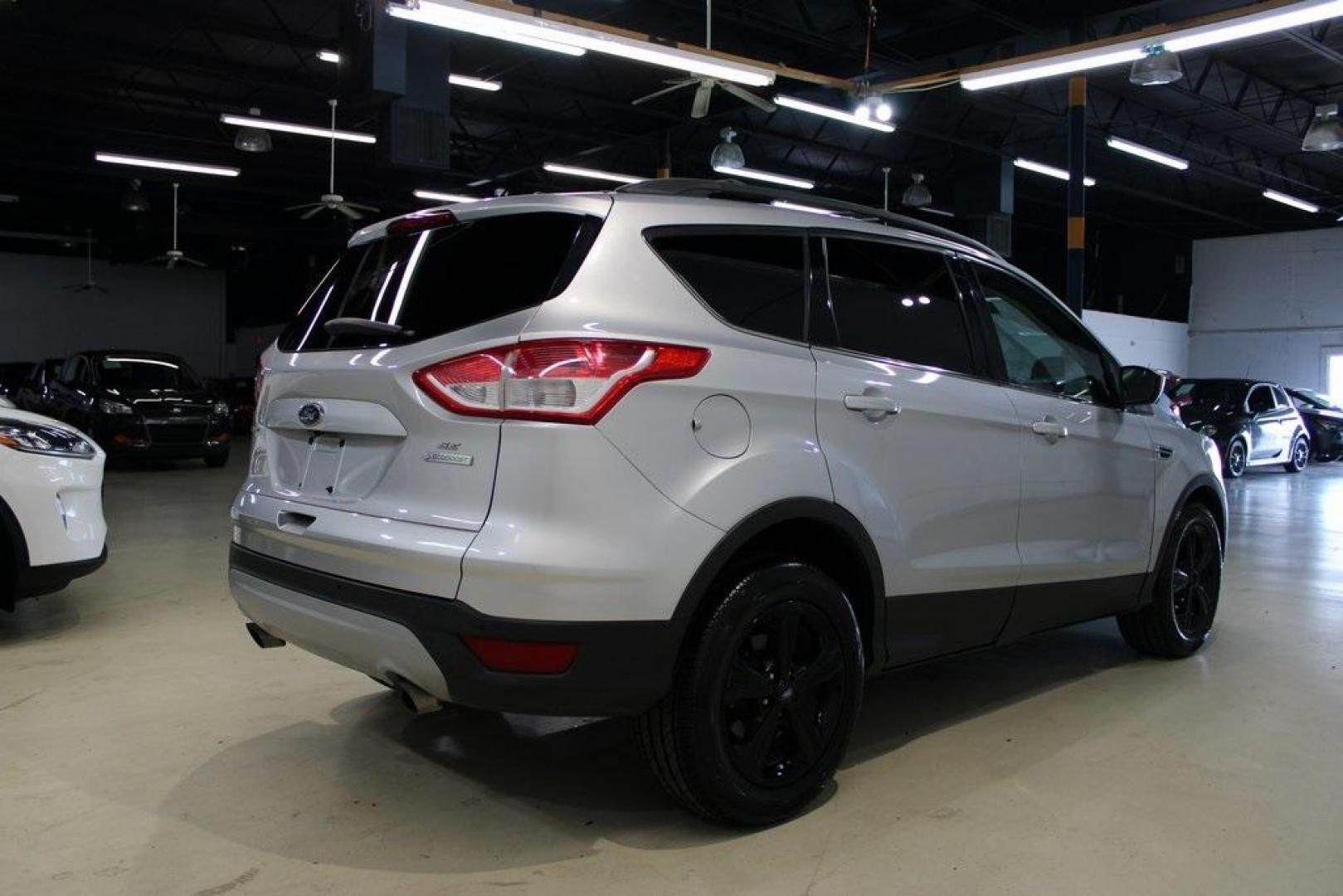 2014 Ingot Silver /Black Ford Escape SE (1FMCU0GX0EU) with an EcoBoost 1.6L I4 GTDi DOHC Turbocharged VCT engine, Automatic transmission, located at 15300 Midway Rd., Addison, TX, 75001, (972) 702-0011, 32.958321, -96.838074 - Photo#2
