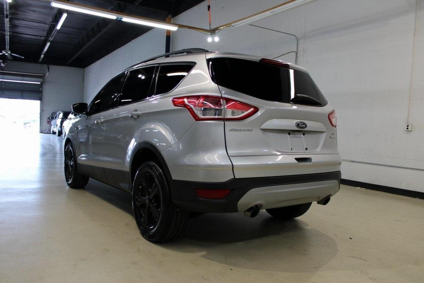 2014 Ingot Silver /Black Ford Escape SE (1FMCU0GX0EU) with an EcoBoost 1.6L I4 GTDi DOHC Turbocharged VCT engine, Automatic transmission, located at 15300 Midway Rd., Addison, TX, 75001, (972) 702-0011, 32.958321, -96.838074 - Photo#3