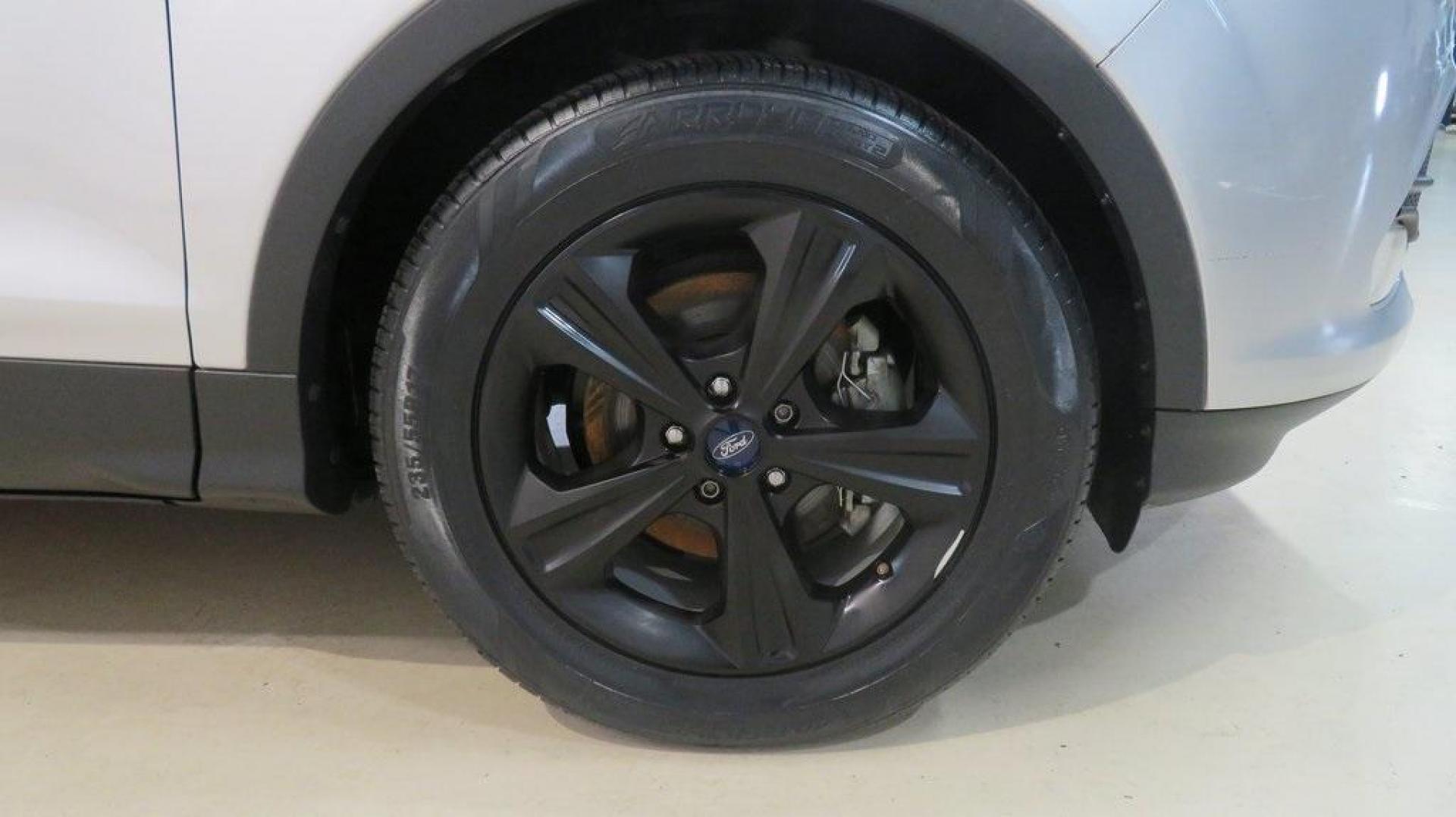 2014 Ingot Silver /Black Ford Escape SE (1FMCU0GX0EU) with an EcoBoost 1.6L I4 GTDi DOHC Turbocharged VCT engine, Automatic transmission, located at 15300 Midway Rd., Addison, TX, 75001, (972) 702-0011, 32.958321, -96.838074 - 2014 Ford Escape SE<br>Now Available at Midway Auto Group Addison, Texas<br><br>Versatile, efficient, and packed with comfort, the 2014 Ford Escape SE is a smart choice for drivers who need capability without sacrificing style. Whether you're commuting through Addison or embarking on weekend getawa - Photo#13