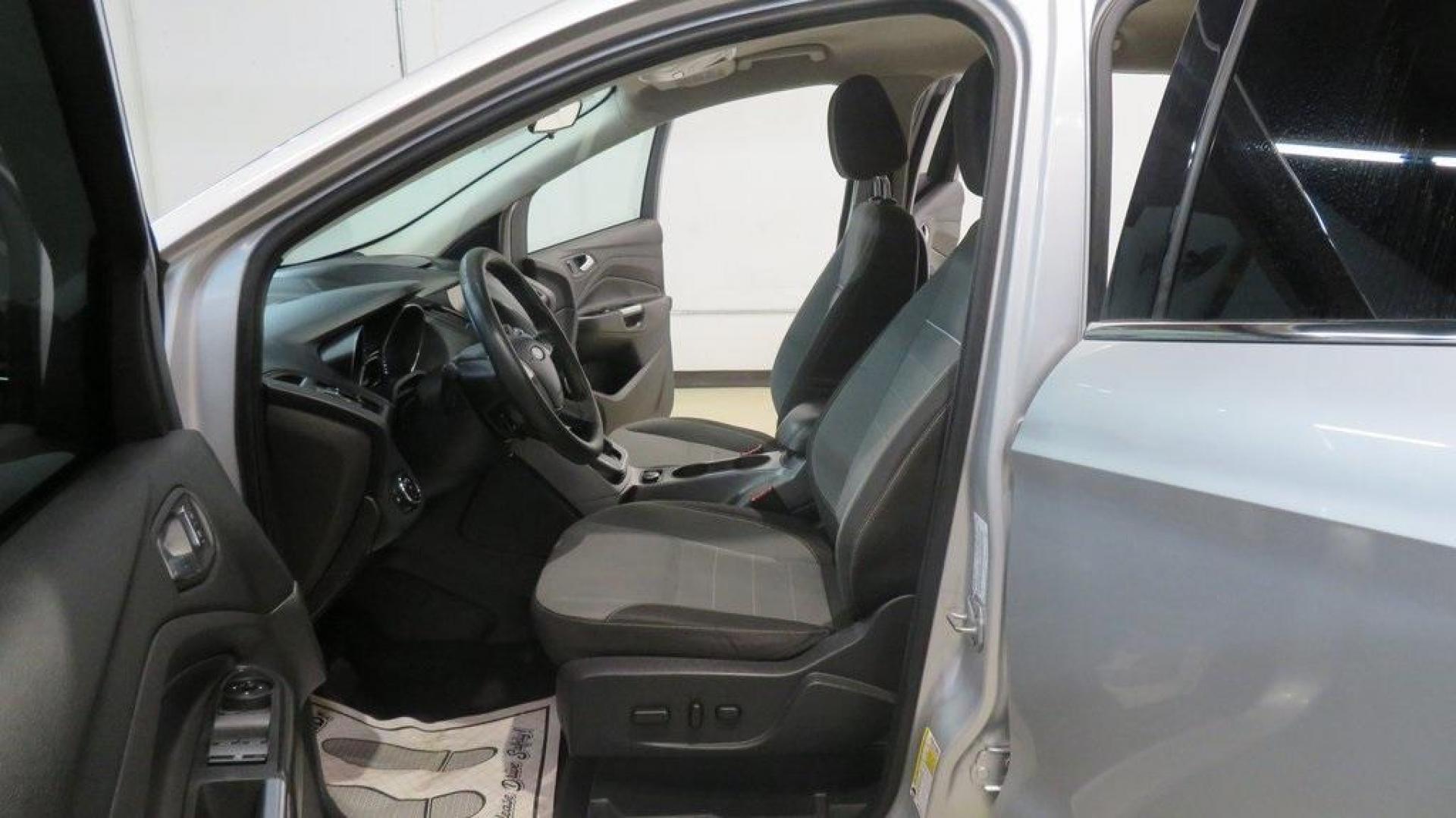 2014 Ingot Silver /Black Ford Escape SE (1FMCU0GX0EU) with an EcoBoost 1.6L I4 GTDi DOHC Turbocharged VCT engine, Automatic transmission, located at 15300 Midway Rd., Addison, TX, 75001, (972) 702-0011, 32.958321, -96.838074 - 2014 Ford Escape SE<br>Now Available at Midway Auto Group Addison, Texas<br><br>Versatile, efficient, and packed with comfort, the 2014 Ford Escape SE is a smart choice for drivers who need capability without sacrificing style. Whether you're commuting through Addison or embarking on weekend getawa - Photo#15