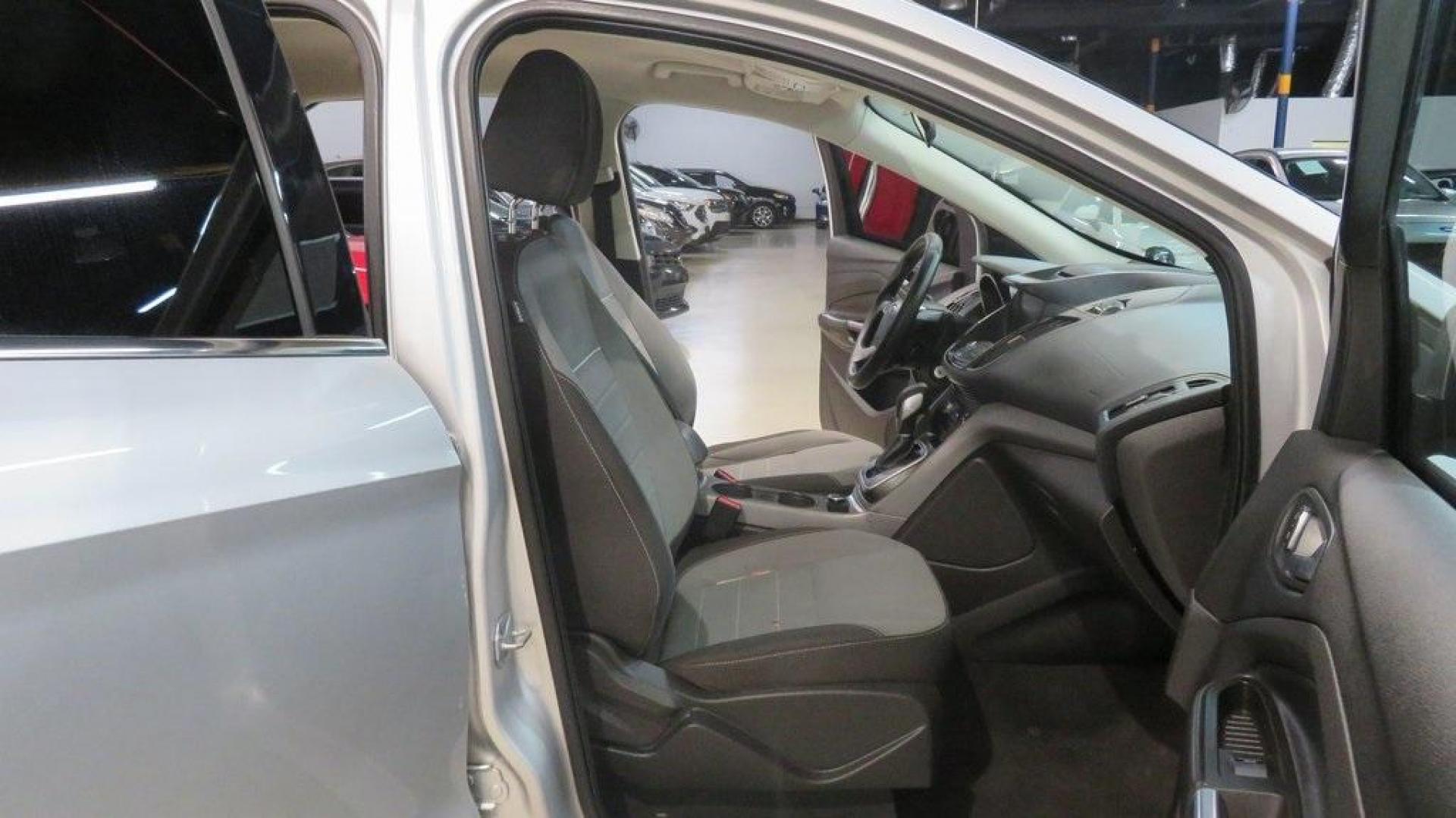 2014 Ingot Silver /Black Ford Escape SE (1FMCU0GX0EU) with an EcoBoost 1.6L I4 GTDi DOHC Turbocharged VCT engine, Automatic transmission, located at 15300 Midway Rd., Addison, TX, 75001, (972) 702-0011, 32.958321, -96.838074 - 2014 Ford Escape SE<br>Now Available at Midway Auto Group Addison, Texas<br><br>Versatile, efficient, and packed with comfort, the 2014 Ford Escape SE is a smart choice for drivers who need capability without sacrificing style. Whether you're commuting through Addison or embarking on weekend getawa - Photo#16