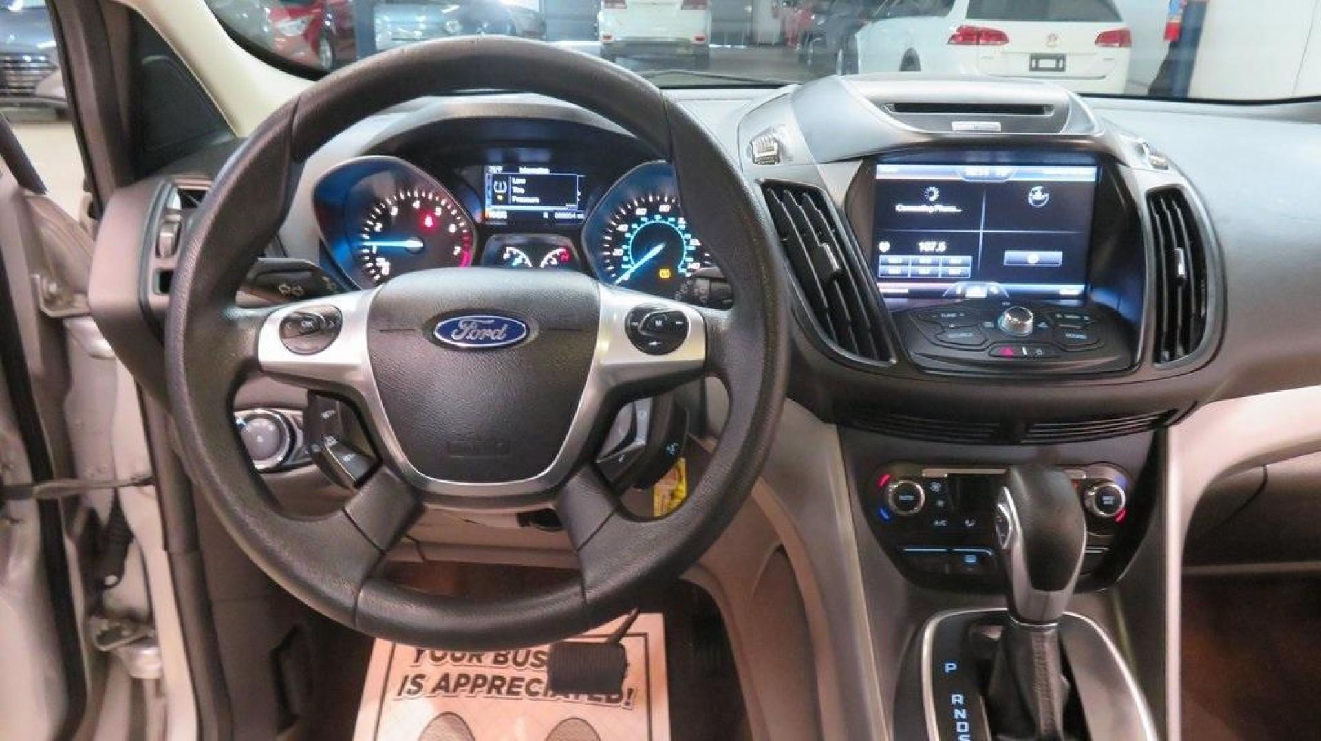 2014 Ingot Silver /Black Ford Escape SE (1FMCU0GX0EU) with an EcoBoost 1.6L I4 GTDi DOHC Turbocharged VCT engine, Automatic transmission, located at 15300 Midway Rd., Addison, TX, 75001, (972) 702-0011, 32.958321, -96.838074 - 2014 Ford Escape SE<br>Now Available at Midway Auto Group Addison, Texas<br><br>Versatile, efficient, and packed with comfort, the 2014 Ford Escape SE is a smart choice for drivers who need capability without sacrificing style. Whether you're commuting through Addison or embarking on weekend getawa - Photo#19