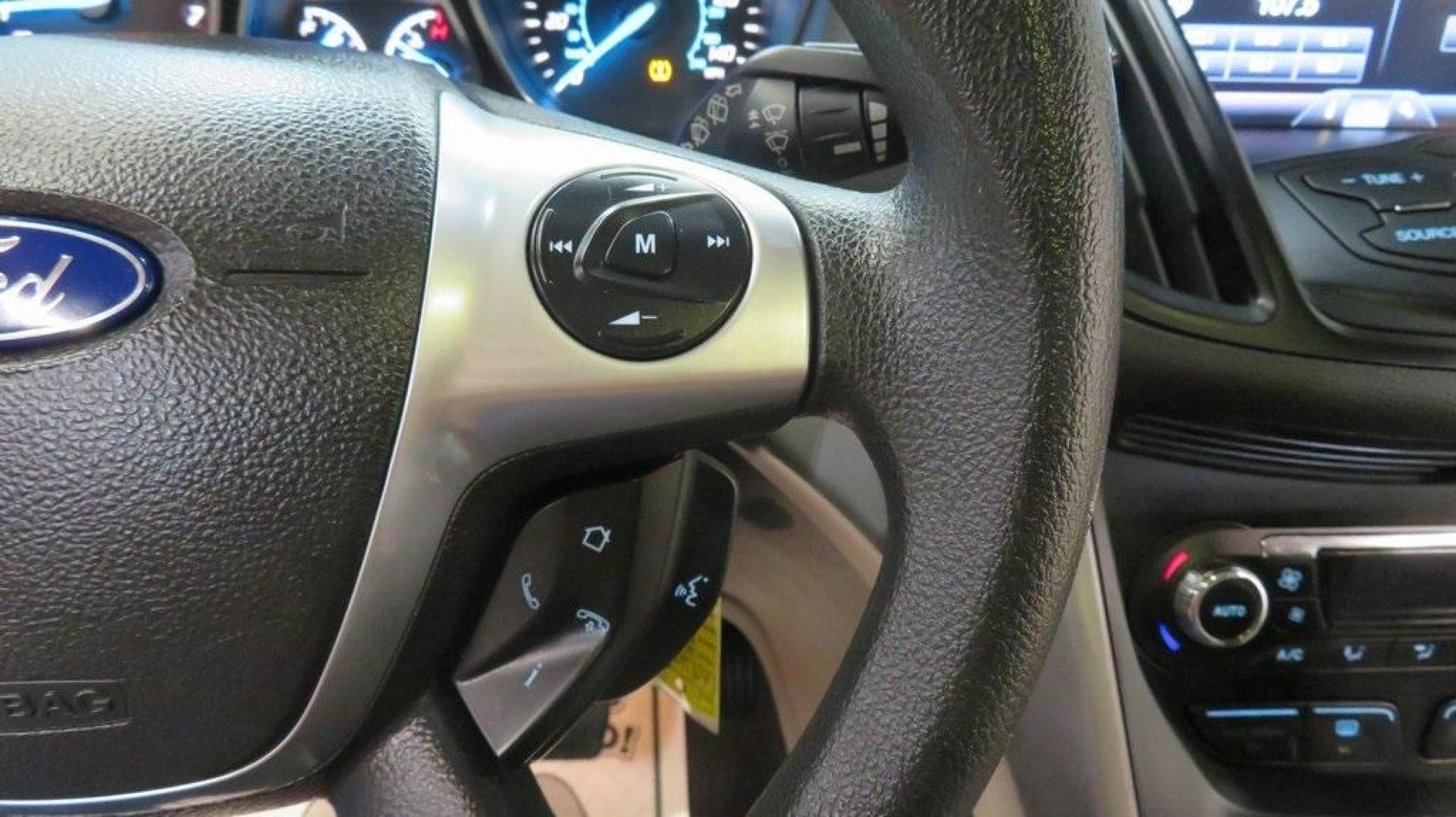 2014 Ingot Silver /Black Ford Escape SE (1FMCU0GX0EU) with an EcoBoost 1.6L I4 GTDi DOHC Turbocharged VCT engine, Automatic transmission, located at 15300 Midway Rd., Addison, TX, 75001, (972) 702-0011, 32.958321, -96.838074 - 2014 Ford Escape SE<br>Now Available at Midway Auto Group Addison, Texas<br><br>Versatile, efficient, and packed with comfort, the 2014 Ford Escape SE is a smart choice for drivers who need capability without sacrificing style. Whether you're commuting through Addison or embarking on weekend getawa - Photo#24