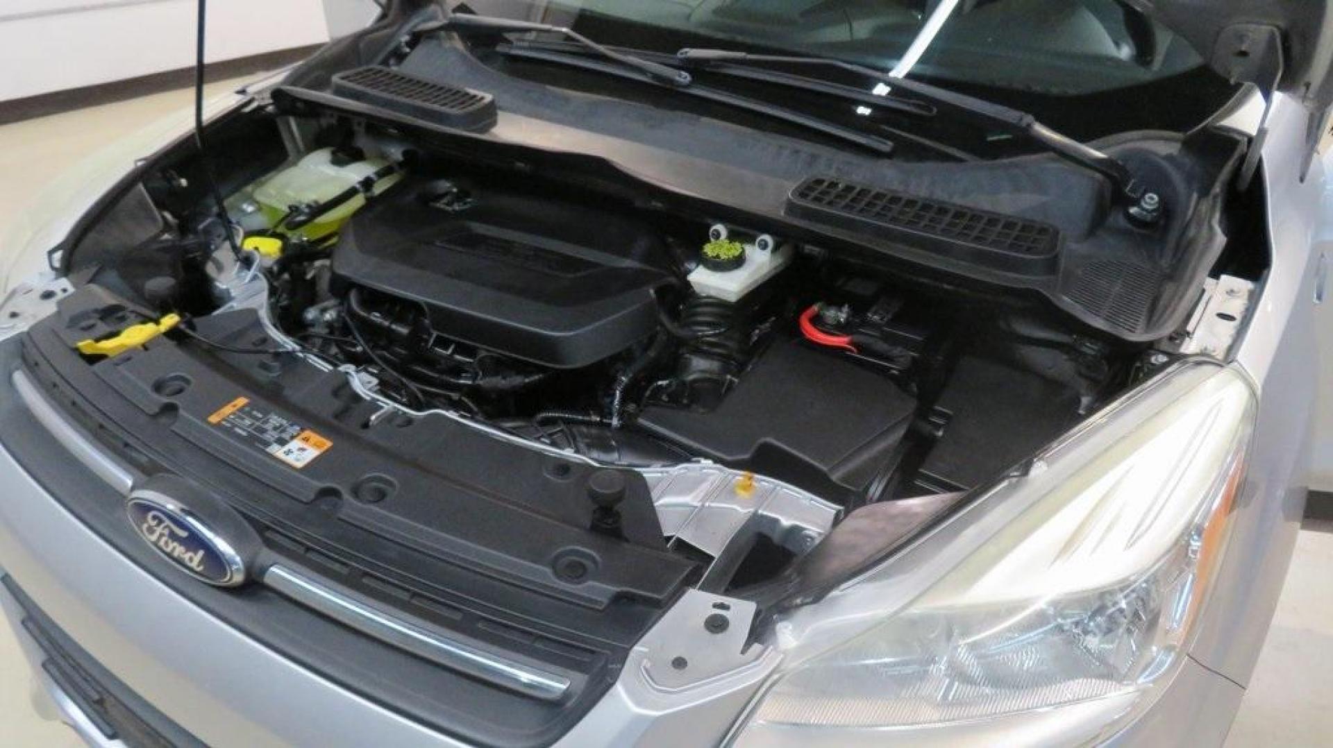 2014 Ingot Silver /Black Ford Escape SE (1FMCU0GX0EU) with an EcoBoost 1.6L I4 GTDi DOHC Turbocharged VCT engine, Automatic transmission, located at 15300 Midway Rd., Addison, TX, 75001, (972) 702-0011, 32.958321, -96.838074 - 2014 Ford Escape SE<br>Now Available at Midway Auto Group Addison, Texas<br><br>Versatile, efficient, and packed with comfort, the 2014 Ford Escape SE is a smart choice for drivers who need capability without sacrificing style. Whether you're commuting through Addison or embarking on weekend getawa - Photo#30