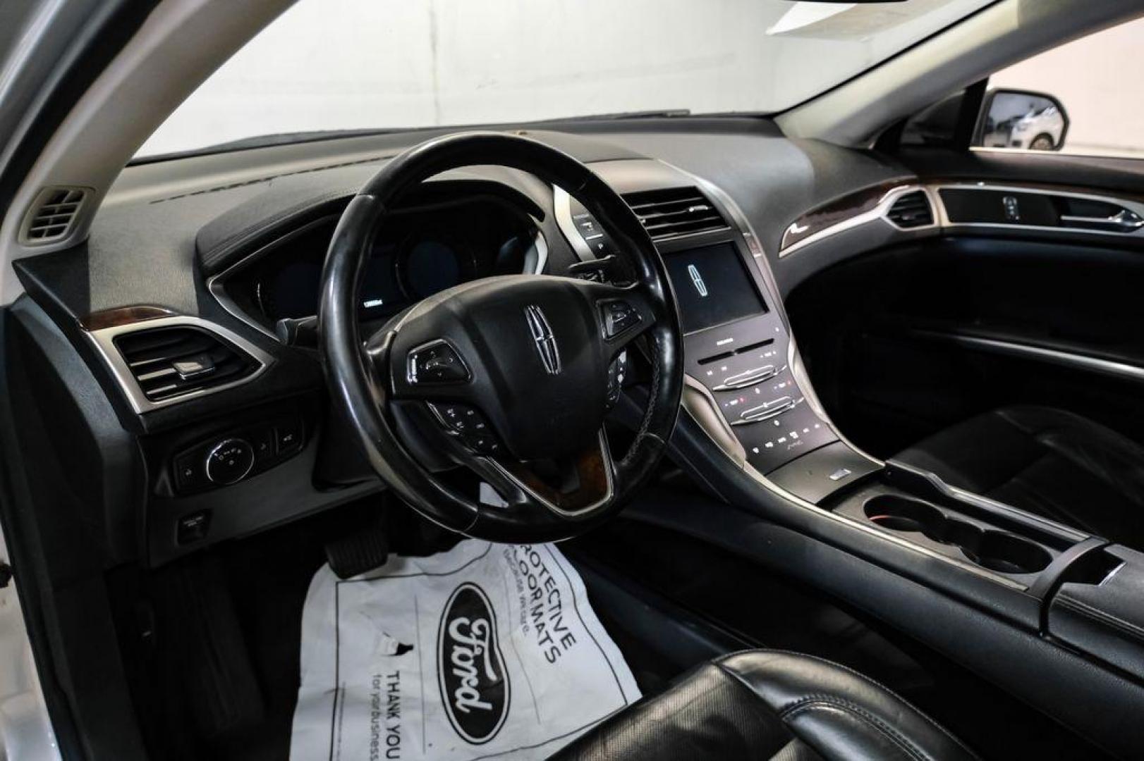 2016 Ingot Silver /Ebony Lincoln MKZ Base (3LN6L2JKXGR) with an 3.7L V6 Ti-VCT 24V engine, Automatic transmission, located at 15300 Midway Rd., Addison, TX, 75001, (972) 702-0011, 32.958321, -96.838074 - 2016 Lincoln MKZ<br>Now Available at Midway Auto Group Addison, Texas<br><br>With elegant styling, smooth turbocharged performance, and a premium interior, the 2016 Lincoln MKZ delivers a refined driving experience thats built to impress. Ideal for drivers looking to elevate their daily commute or - Photo#1