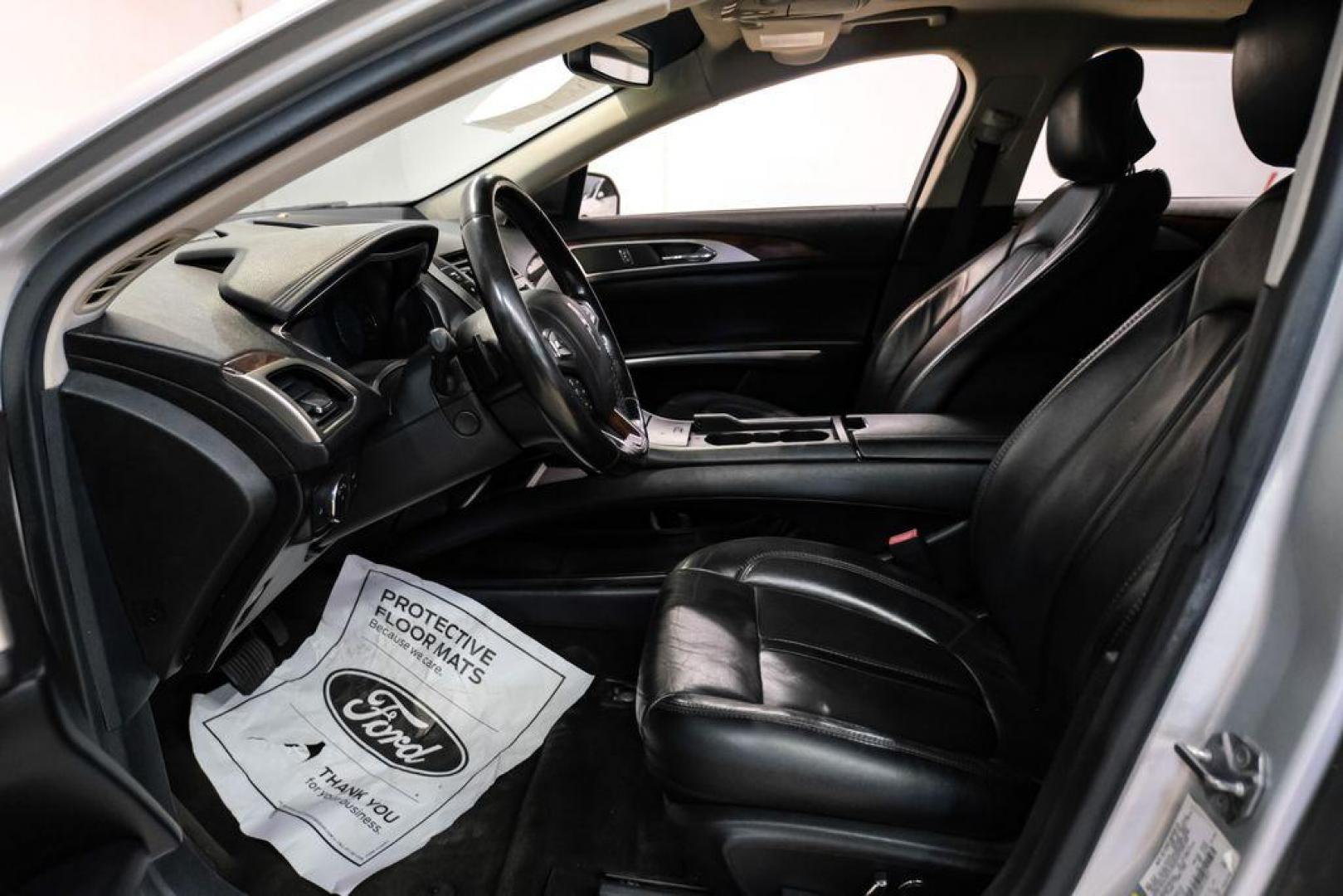 2016 Ingot Silver /Ebony Lincoln MKZ Base (3LN6L2JKXGR) with an 3.7L V6 Ti-VCT 24V engine, Automatic transmission, located at 15300 Midway Rd., Addison, TX, 75001, (972) 702-0011, 32.958321, -96.838074 - 2016 Lincoln MKZ<br>Now Available at Midway Auto Group Addison, Texas<br><br>With elegant styling, smooth turbocharged performance, and a premium interior, the 2016 Lincoln MKZ delivers a refined driving experience thats built to impress. Ideal for drivers looking to elevate their daily commute or - Photo#3