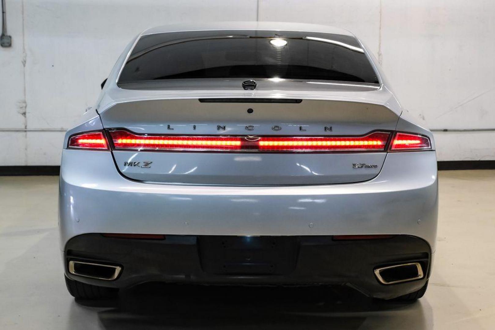 2016 Ingot Silver /Ebony Lincoln MKZ Base (3LN6L2JKXGR) with an 3.7L V6 Ti-VCT 24V engine, Automatic transmission, located at 15300 Midway Rd., Addison, TX, 75001, (972) 702-0011, 32.958321, -96.838074 - 2016 Lincoln MKZ<br>Now Available at Midway Auto Group Addison, Texas<br><br>With elegant styling, smooth turbocharged performance, and a premium interior, the 2016 Lincoln MKZ delivers a refined driving experience thats built to impress. Ideal for drivers looking to elevate their daily commute or - Photo#9
