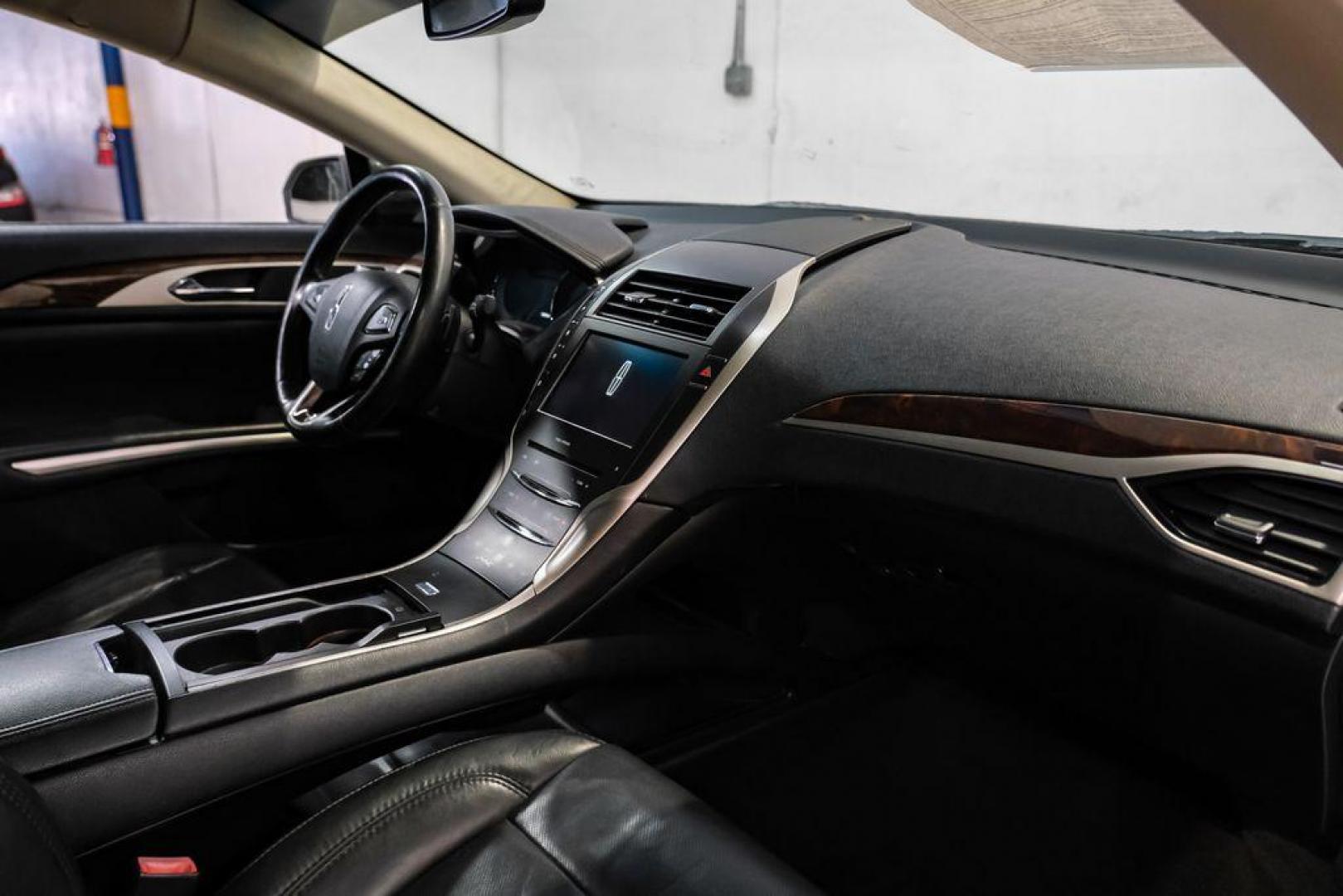 2016 Ingot Silver /Ebony Lincoln MKZ Base (3LN6L2JKXGR) with an 3.7L V6 Ti-VCT 24V engine, Automatic transmission, located at 15300 Midway Rd., Addison, TX, 75001, (972) 702-0011, 32.958321, -96.838074 - 2016 Lincoln MKZ<br>Now Available at Midway Auto Group Addison, Texas<br><br>With elegant styling, smooth turbocharged performance, and a premium interior, the 2016 Lincoln MKZ delivers a refined driving experience thats built to impress. Ideal for drivers looking to elevate their daily commute or - Photo#14