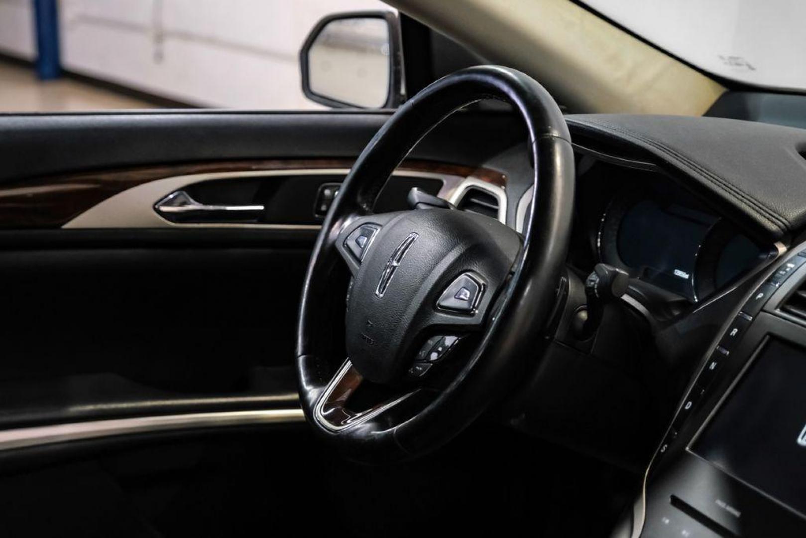 2016 Ingot Silver /Ebony Lincoln MKZ Base (3LN6L2JKXGR) with an 3.7L V6 Ti-VCT 24V engine, Automatic transmission, located at 15300 Midway Rd., Addison, TX, 75001, (972) 702-0011, 32.958321, -96.838074 - 2016 Lincoln MKZ<br>Now Available at Midway Auto Group Addison, Texas<br><br>With elegant styling, smooth turbocharged performance, and a premium interior, the 2016 Lincoln MKZ delivers a refined driving experience thats built to impress. Ideal for drivers looking to elevate their daily commute or - Photo#15