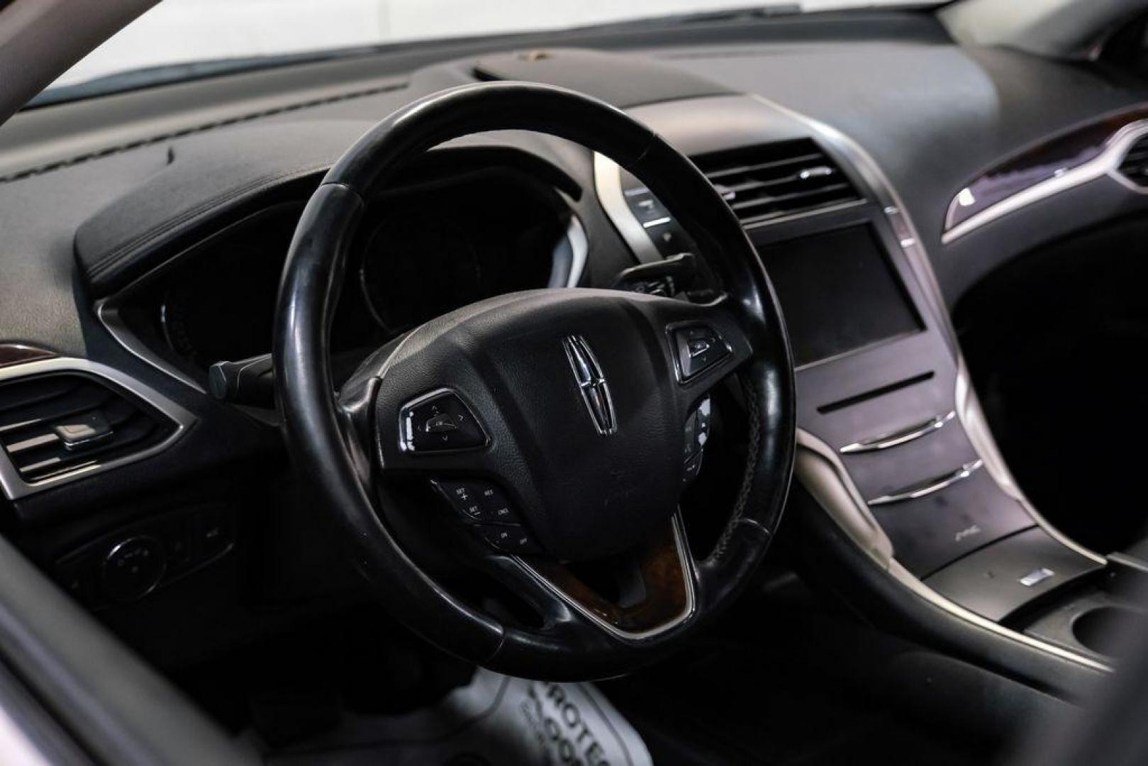 2016 Ingot Silver /Ebony Lincoln MKZ Base (3LN6L2JKXGR) with an 3.7L V6 Ti-VCT 24V engine, Automatic transmission, located at 15300 Midway Rd., Addison, TX, 75001, (972) 702-0011, 32.958321, -96.838074 - 2016 Lincoln MKZ<br>Now Available at Midway Auto Group Addison, Texas<br><br>With elegant styling, smooth turbocharged performance, and a premium interior, the 2016 Lincoln MKZ delivers a refined driving experience thats built to impress. Ideal for drivers looking to elevate their daily commute or - Photo#17