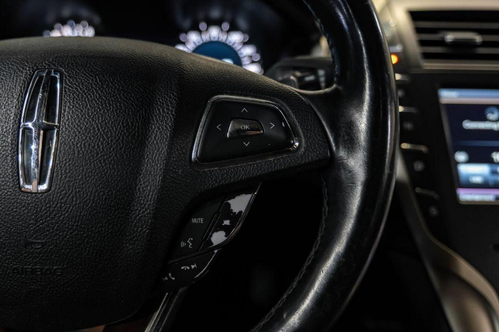 2016 Ingot Silver /Ebony Lincoln MKZ Base (3LN6L2JKXGR) with an 3.7L V6 Ti-VCT 24V engine, Automatic transmission, located at 15300 Midway Rd., Addison, TX, 75001, (972) 702-0011, 32.958321, -96.838074 - 2016 Lincoln MKZ<br>Now Available at Midway Auto Group Addison, Texas<br><br>With elegant styling, smooth turbocharged performance, and a premium interior, the 2016 Lincoln MKZ delivers a refined driving experience thats built to impress. Ideal for drivers looking to elevate their daily commute or - Photo#19