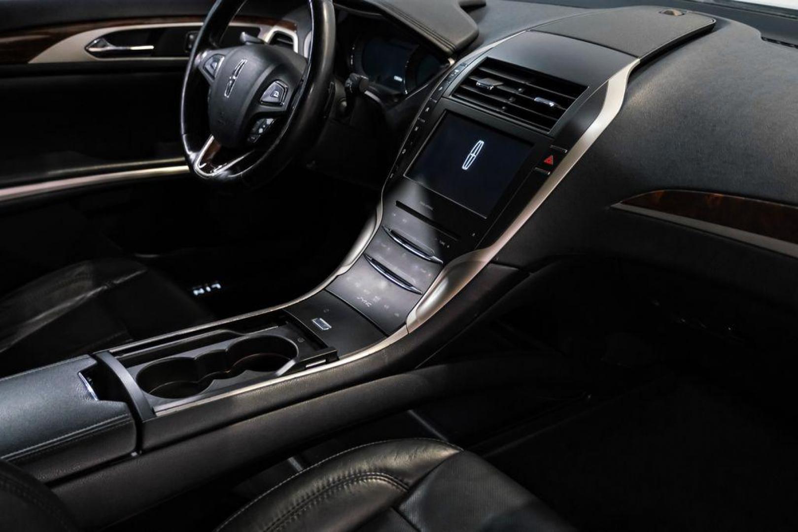 2016 Ingot Silver /Ebony Lincoln MKZ Base (3LN6L2JKXGR) with an 3.7L V6 Ti-VCT 24V engine, Automatic transmission, located at 15300 Midway Rd., Addison, TX, 75001, (972) 702-0011, 32.958321, -96.838074 - 2016 Lincoln MKZ<br>Now Available at Midway Auto Group Addison, Texas<br><br>With elegant styling, smooth turbocharged performance, and a premium interior, the 2016 Lincoln MKZ delivers a refined driving experience thats built to impress. Ideal for drivers looking to elevate their daily commute or - Photo#24