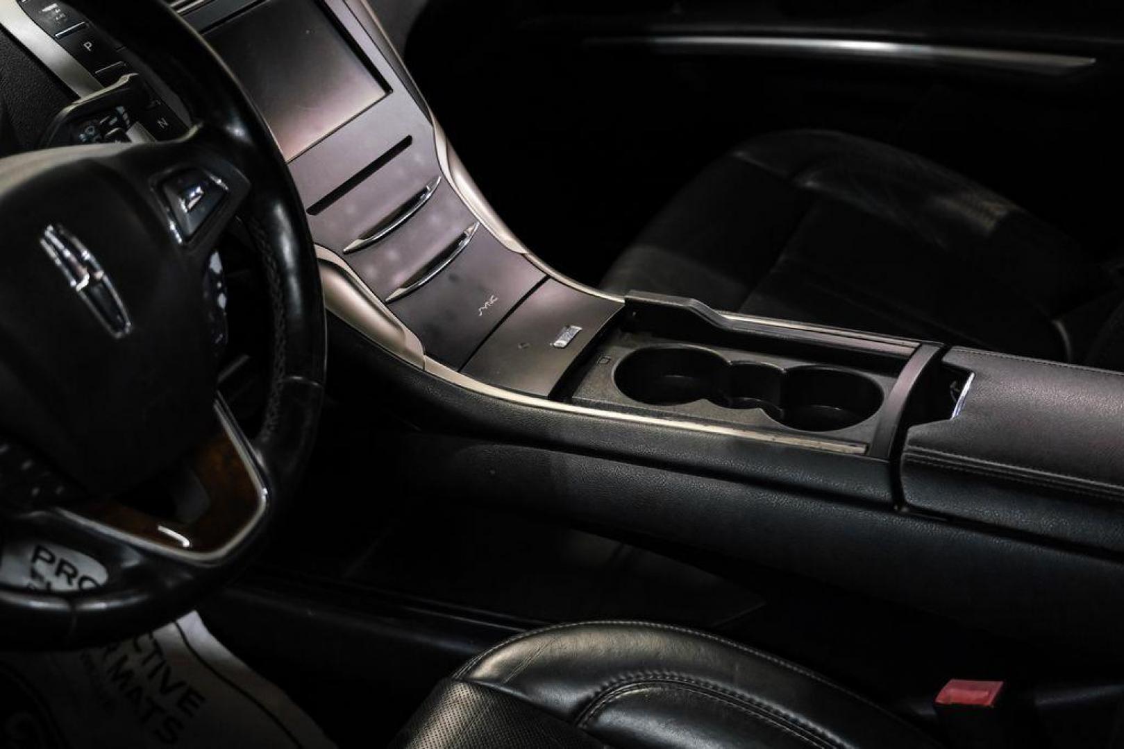 2016 Ingot Silver /Ebony Lincoln MKZ Base (3LN6L2JKXGR) with an 3.7L V6 Ti-VCT 24V engine, Automatic transmission, located at 15300 Midway Rd., Addison, TX, 75001, (972) 702-0011, 32.958321, -96.838074 - 2016 Lincoln MKZ<br>Now Available at Midway Auto Group Addison, Texas<br><br>With elegant styling, smooth turbocharged performance, and a premium interior, the 2016 Lincoln MKZ delivers a refined driving experience thats built to impress. Ideal for drivers looking to elevate their daily commute or - Photo#25