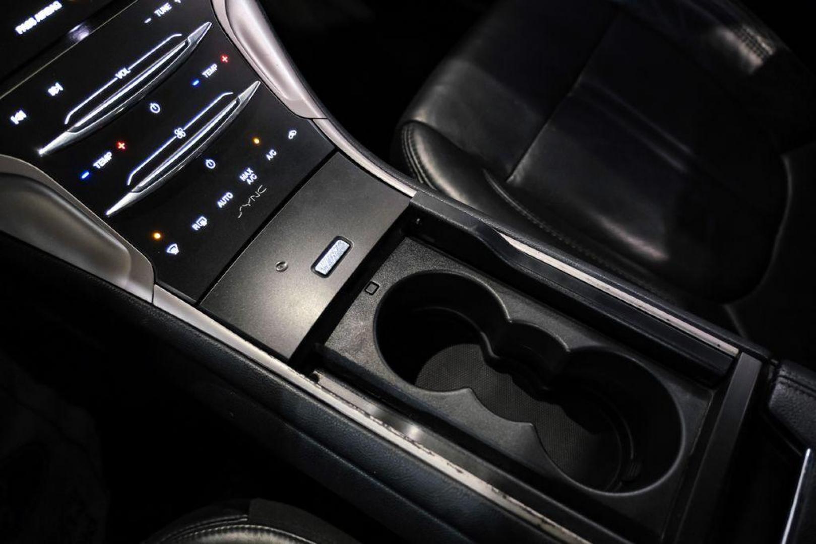 2016 Ingot Silver /Ebony Lincoln MKZ Base (3LN6L2JKXGR) with an 3.7L V6 Ti-VCT 24V engine, Automatic transmission, located at 15300 Midway Rd., Addison, TX, 75001, (972) 702-0011, 32.958321, -96.838074 - 2016 Lincoln MKZ<br>Now Available at Midway Auto Group Addison, Texas<br><br>With elegant styling, smooth turbocharged performance, and a premium interior, the 2016 Lincoln MKZ delivers a refined driving experience thats built to impress. Ideal for drivers looking to elevate their daily commute or - Photo#26