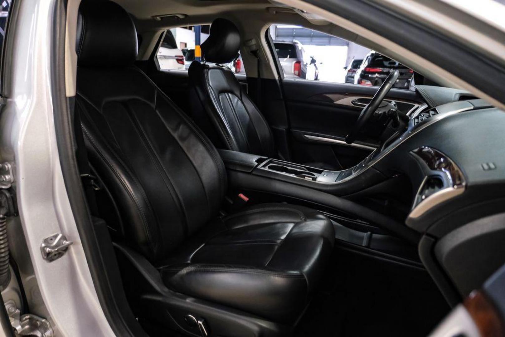 2016 Ingot Silver /Ebony Lincoln MKZ Base (3LN6L2JKXGR) with an 3.7L V6 Ti-VCT 24V engine, Automatic transmission, located at 15300 Midway Rd., Addison, TX, 75001, (972) 702-0011, 32.958321, -96.838074 - 2016 Lincoln MKZ<br>Now Available at Midway Auto Group Addison, Texas<br><br>With elegant styling, smooth turbocharged performance, and a premium interior, the 2016 Lincoln MKZ delivers a refined driving experience thats built to impress. Ideal for drivers looking to elevate their daily commute or - Photo#32