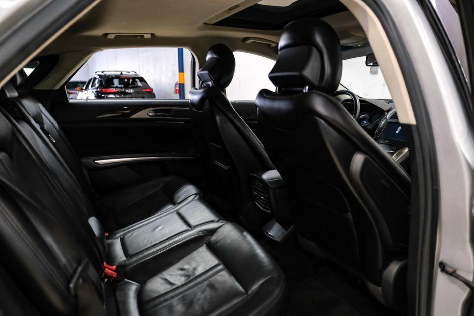 2016 Ingot Silver /Ebony Lincoln MKZ Base (3LN6L2JKXGR) with an 3.7L V6 Ti-VCT 24V engine, Automatic transmission, located at 15300 Midway Rd., Addison, TX, 75001, (972) 702-0011, 32.958321, -96.838074 - 2016 Lincoln MKZ<br>Now Available at Midway Auto Group Addison, Texas<br><br>With elegant styling, smooth turbocharged performance, and a premium interior, the 2016 Lincoln MKZ delivers a refined driving experience thats built to impress. Ideal for drivers looking to elevate their daily commute or - Photo#34