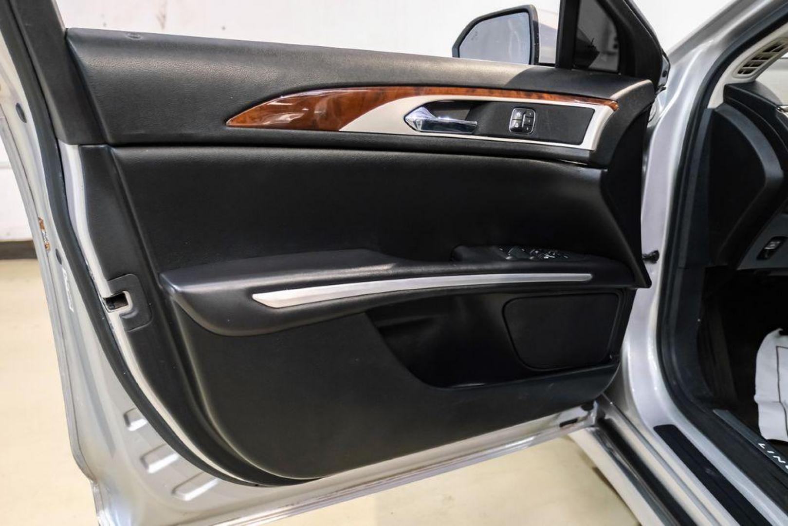 2016 Ingot Silver /Ebony Lincoln MKZ Base (3LN6L2JKXGR) with an 3.7L V6 Ti-VCT 24V engine, Automatic transmission, located at 15300 Midway Rd., Addison, TX, 75001, (972) 702-0011, 32.958321, -96.838074 - 2016 Lincoln MKZ<br>Now Available at Midway Auto Group Addison, Texas<br><br>With elegant styling, smooth turbocharged performance, and a premium interior, the 2016 Lincoln MKZ delivers a refined driving experience thats built to impress. Ideal for drivers looking to elevate their daily commute or - Photo#39