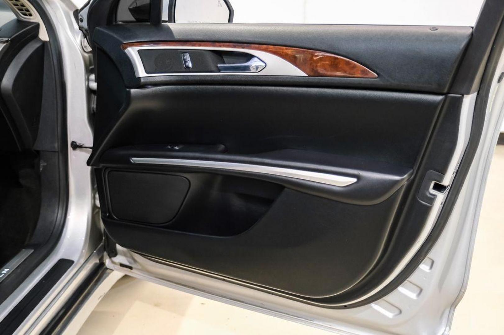 2016 Ingot Silver /Ebony Lincoln MKZ Base (3LN6L2JKXGR) with an 3.7L V6 Ti-VCT 24V engine, Automatic transmission, located at 15300 Midway Rd., Addison, TX, 75001, (972) 702-0011, 32.958321, -96.838074 - 2016 Lincoln MKZ<br>Now Available at Midway Auto Group Addison, Texas<br><br>With elegant styling, smooth turbocharged performance, and a premium interior, the 2016 Lincoln MKZ delivers a refined driving experience thats built to impress. Ideal for drivers looking to elevate their daily commute or - Photo#41