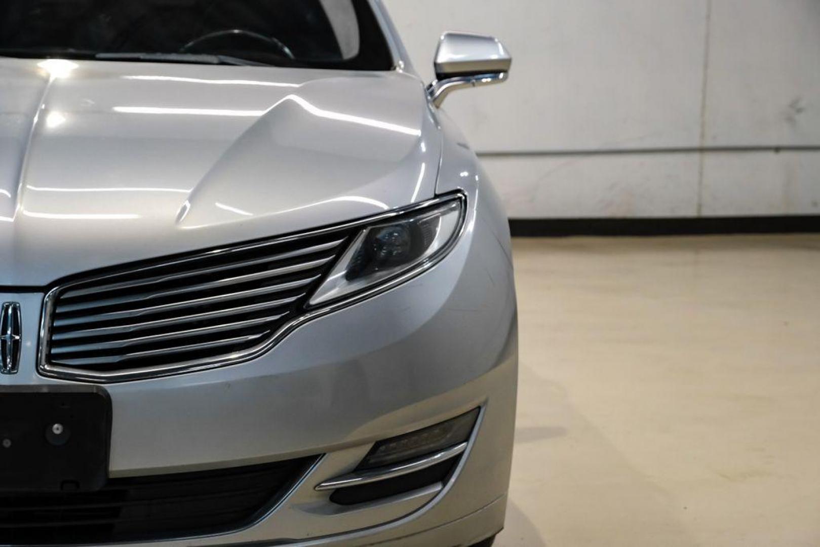 2016 Ingot Silver /Ebony Lincoln MKZ Base (3LN6L2JKXGR) with an 3.7L V6 Ti-VCT 24V engine, Automatic transmission, located at 15300 Midway Rd., Addison, TX, 75001, (972) 702-0011, 32.958321, -96.838074 - 2016 Lincoln MKZ<br>Now Available at Midway Auto Group Addison, Texas<br><br>With elegant styling, smooth turbocharged performance, and a premium interior, the 2016 Lincoln MKZ delivers a refined driving experience thats built to impress. Ideal for drivers looking to elevate their daily commute or - Photo#44