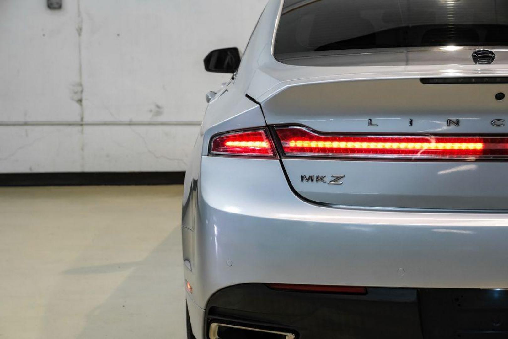 2016 Ingot Silver /Ebony Lincoln MKZ Base (3LN6L2JKXGR) with an 3.7L V6 Ti-VCT 24V engine, Automatic transmission, located at 15300 Midway Rd., Addison, TX, 75001, (972) 702-0011, 32.958321, -96.838074 - 2016 Lincoln MKZ<br>Now Available at Midway Auto Group Addison, Texas<br><br>With elegant styling, smooth turbocharged performance, and a premium interior, the 2016 Lincoln MKZ delivers a refined driving experience thats built to impress. Ideal for drivers looking to elevate their daily commute or - Photo#45