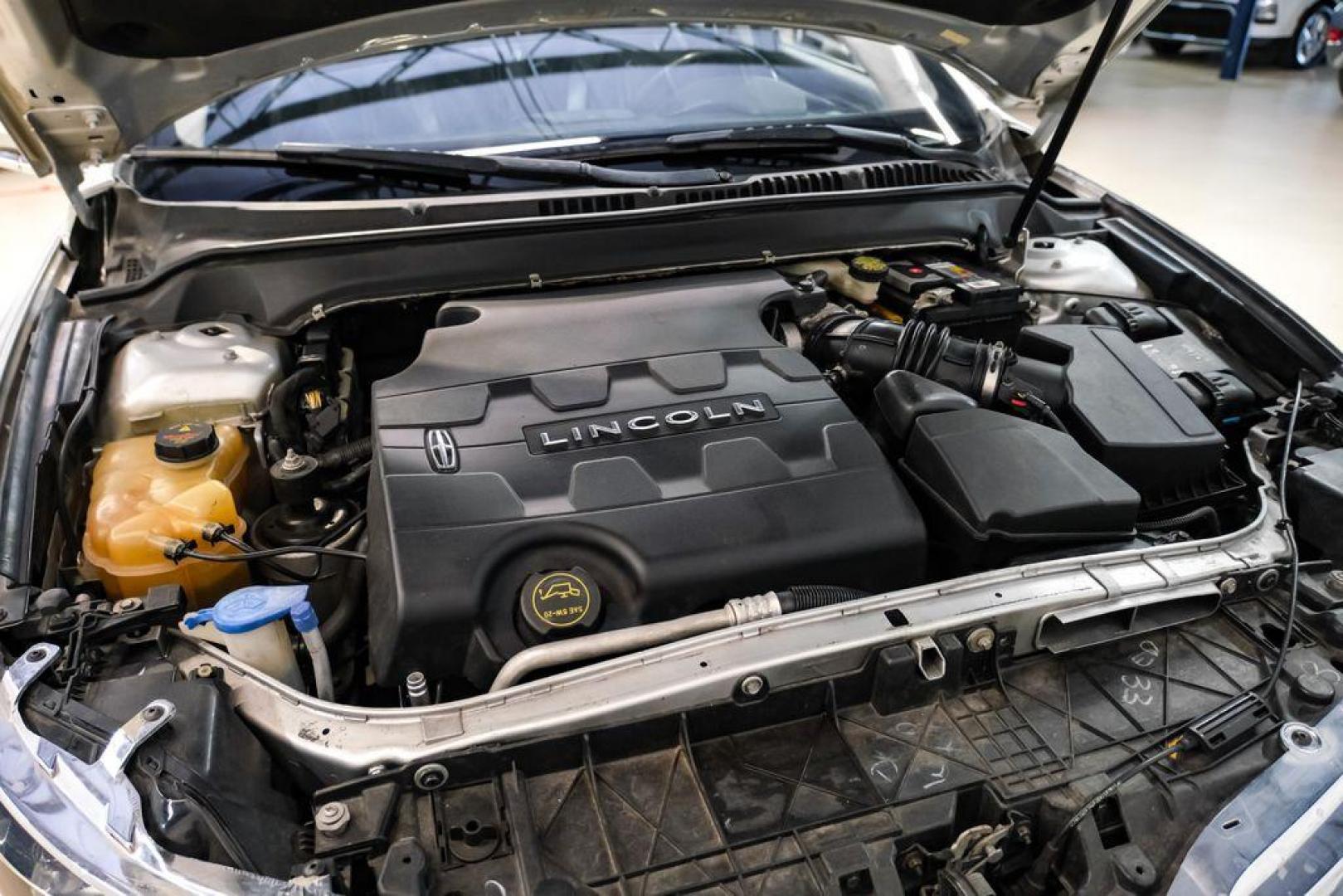 2016 Ingot Silver /Ebony Lincoln MKZ Base (3LN6L2JKXGR) with an 3.7L V6 Ti-VCT 24V engine, Automatic transmission, located at 15300 Midway Rd., Addison, TX, 75001, (972) 702-0011, 32.958321, -96.838074 - 2016 Lincoln MKZ<br>Now Available at Midway Auto Group Addison, Texas<br><br>With elegant styling, smooth turbocharged performance, and a premium interior, the 2016 Lincoln MKZ delivers a refined driving experience thats built to impress. Ideal for drivers looking to elevate their daily commute or - Photo#49