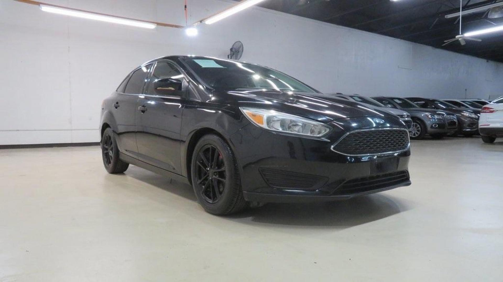 2018 Shadow Black /Charcoal Black Ford Focus SE (1FADP3F26JL) with an 2.0L I4 DGI Ti-VCT engine, Automatic transmission, located at 15300 Midway Rd., Addison, TX, 75001, (972) 702-0011, 32.958321, -96.838074 - Photo#1