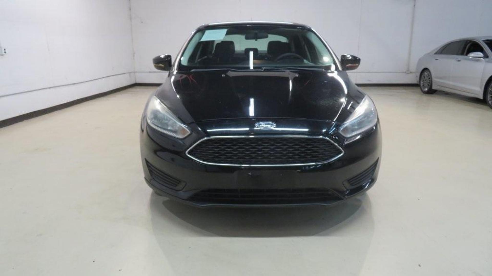 2018 Shadow Black /Charcoal Black Ford Focus SE (1FADP3F26JL) with an 2.0L I4 DGI Ti-VCT engine, Automatic transmission, located at 15300 Midway Rd., Addison, TX, 75001, (972) 702-0011, 32.958321, -96.838074 - Photo#5
