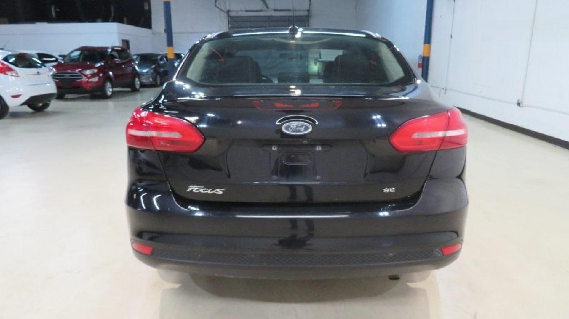 2018 Shadow Black /Charcoal Black Ford Focus SE (1FADP3F26JL) with an 2.0L I4 DGI Ti-VCT engine, Automatic transmission, located at 15300 Midway Rd., Addison, TX, 75001, (972) 702-0011, 32.958321, -96.838074 - Photo#7